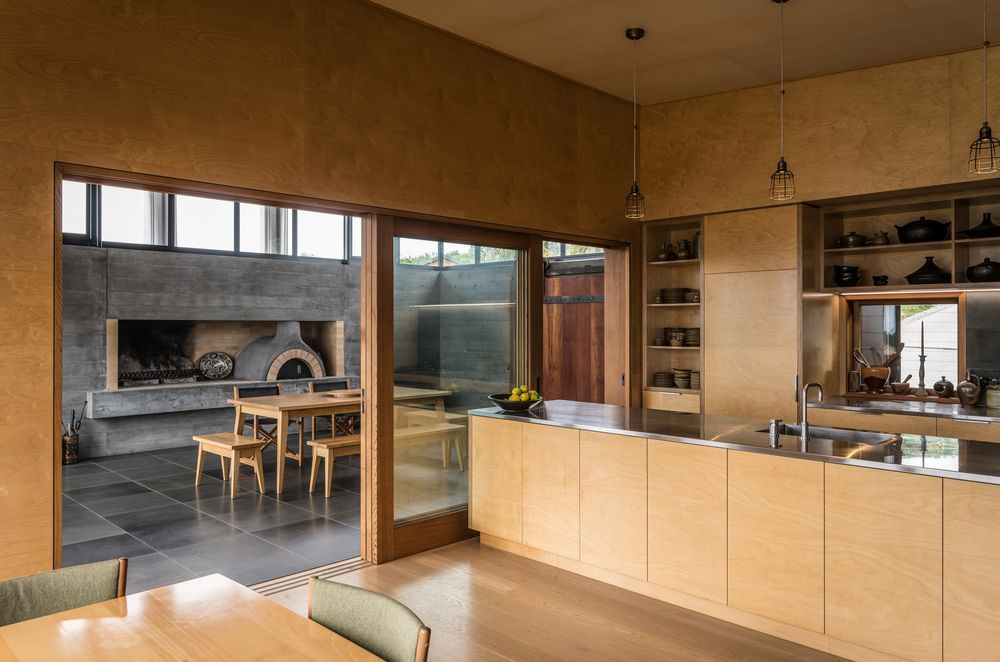Mark is a big fan on the ‘pizza oven room’. “The detailing on that cedar sarking is really good, the basalt flooring is very practical, and the pizza oven and fire are used a lot,” he says.