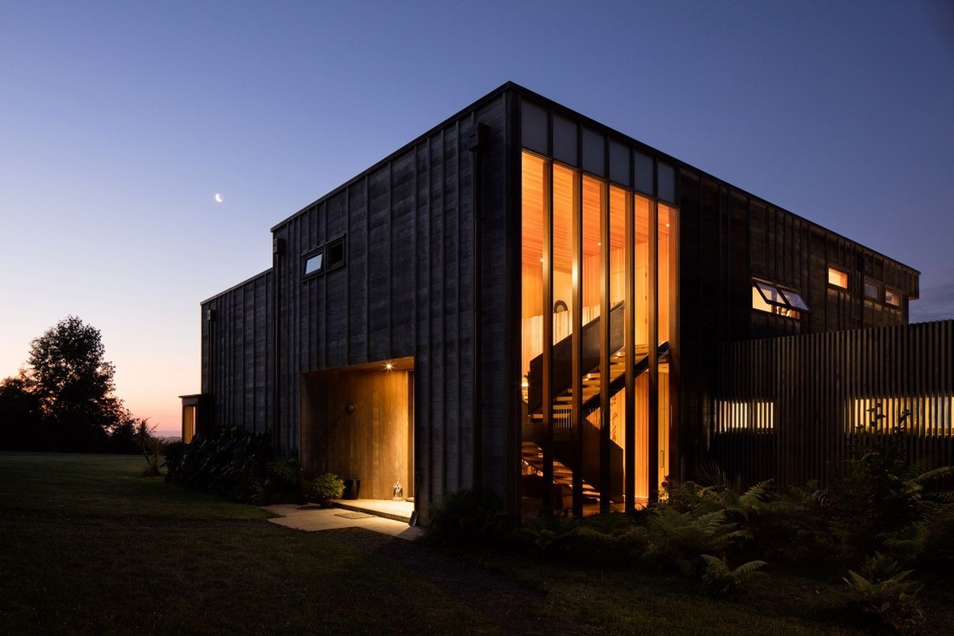 The highly detailed Bach Bach by night. By Crosson Architects, photo by Jason Mann Photography.