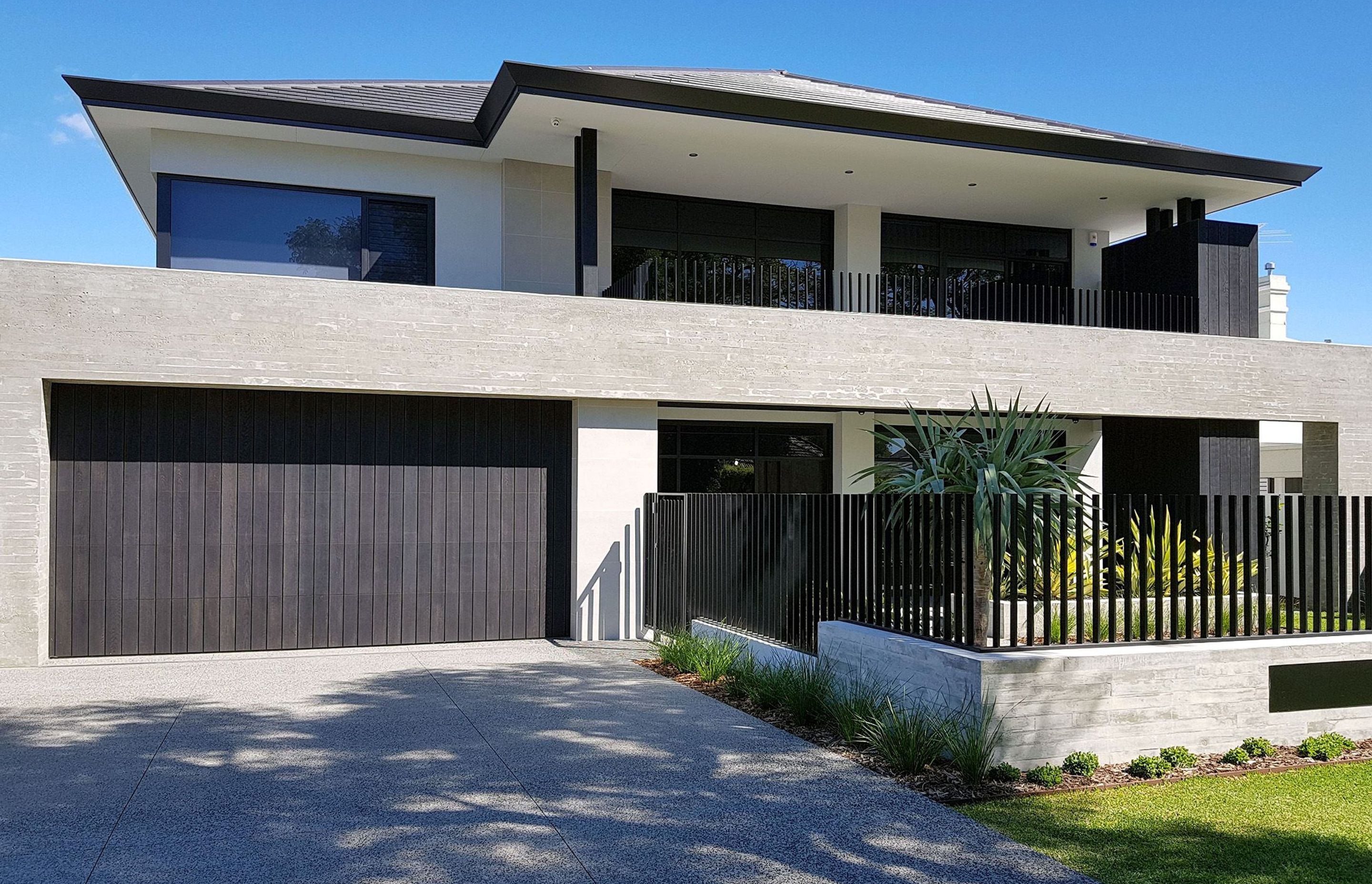 Composite material-clad garage door on a new build.