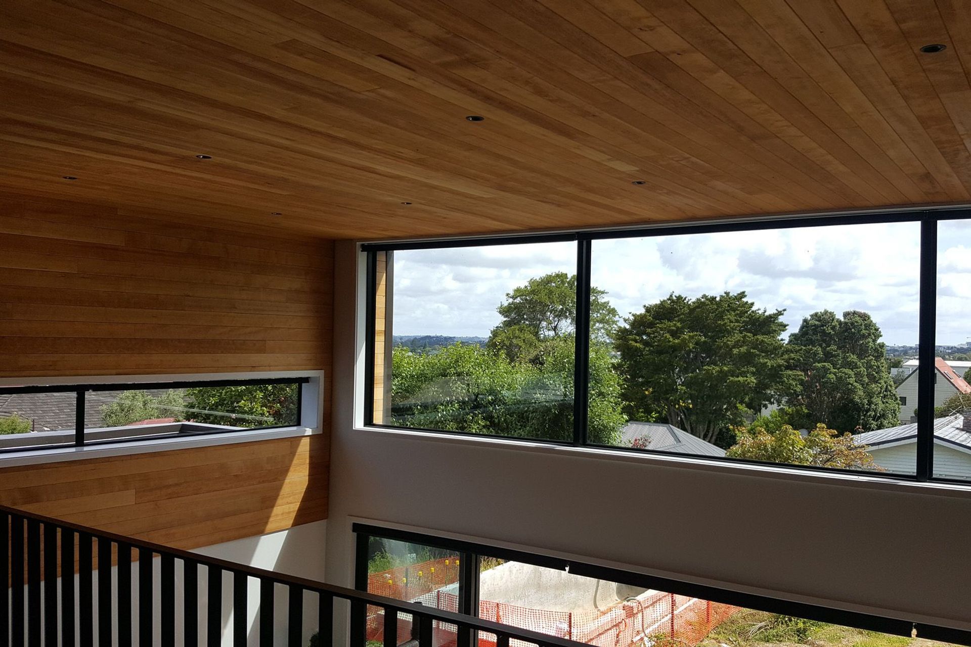 The warm tones of western hemlock work well for residential walls and ceilings.