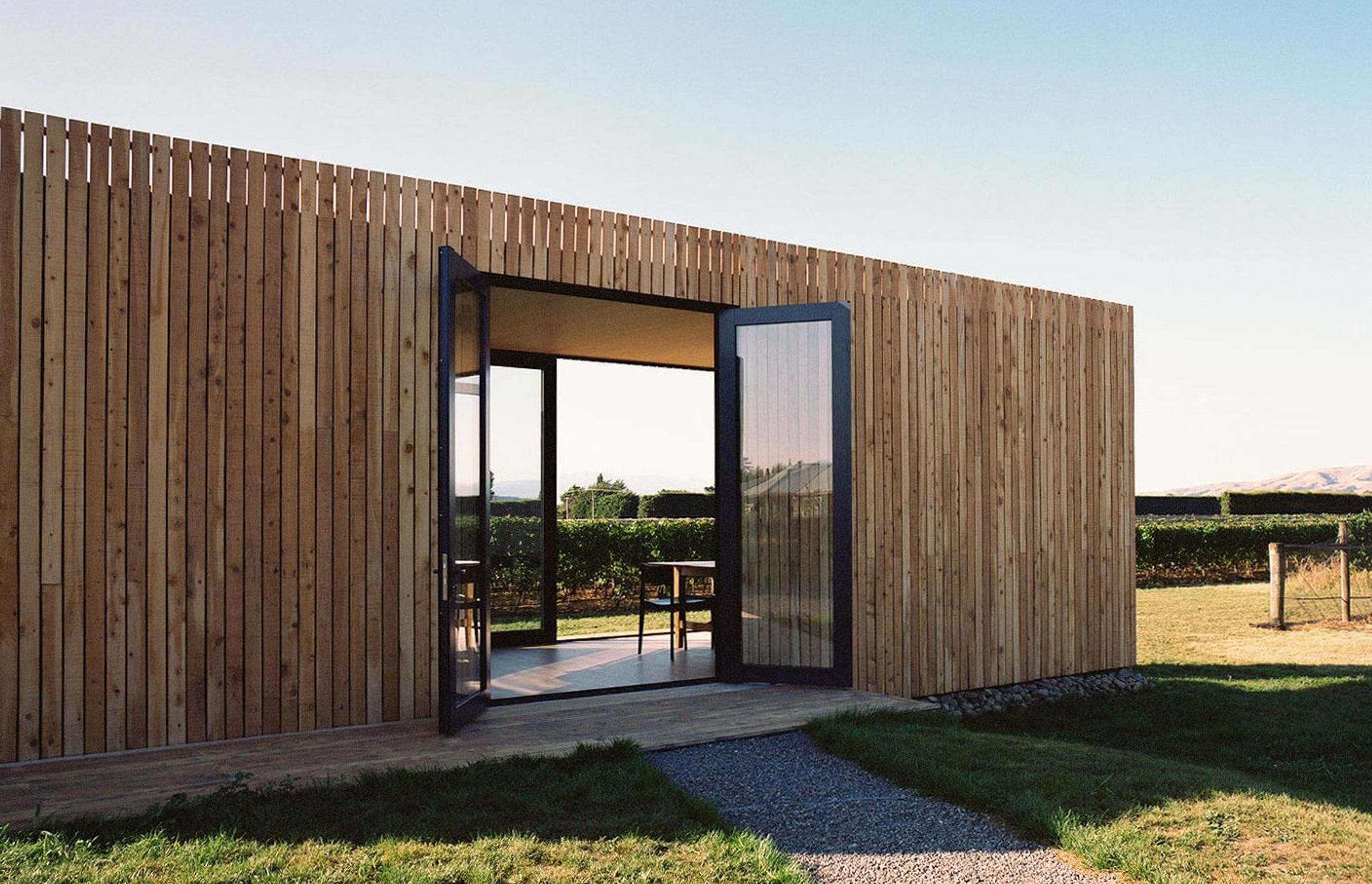 Located on a Martinborough vineyard, On Giant's Shoulders' tasting room was prefabricated using CLT construction as a complete building in Wellington, then transported over the Rimutaka Ranges via truck and assembled on site.