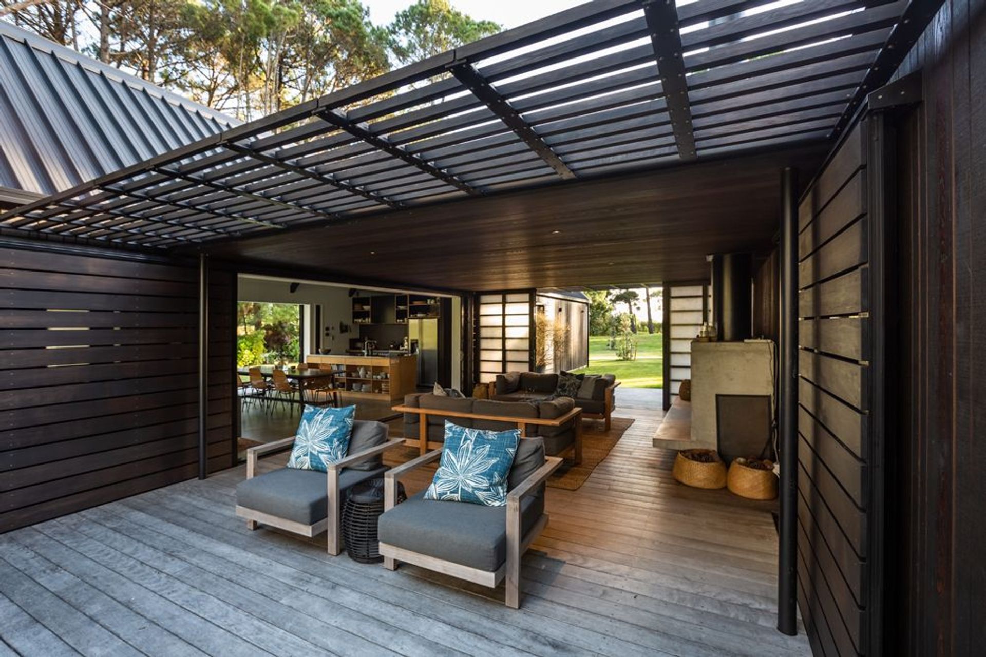 The central sheltered living area extends to a generous open-air deck. 