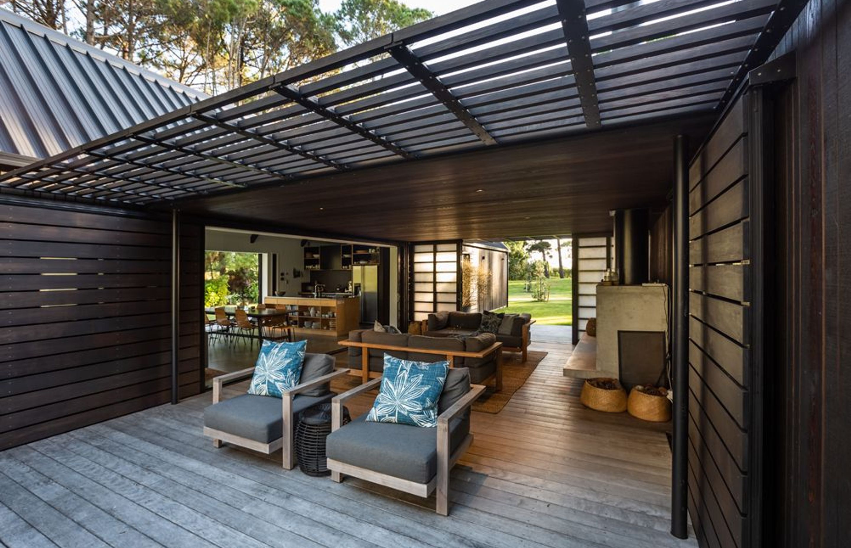 The central sheltered living area extends to a generous open-air deck. 