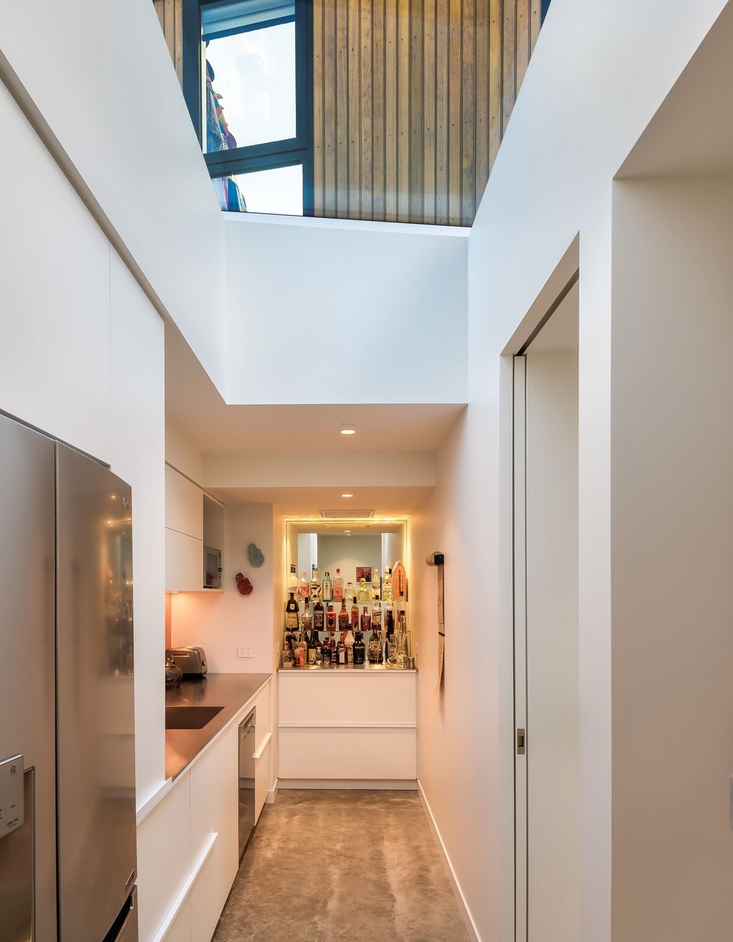 The bar is built into the end of the scullery.