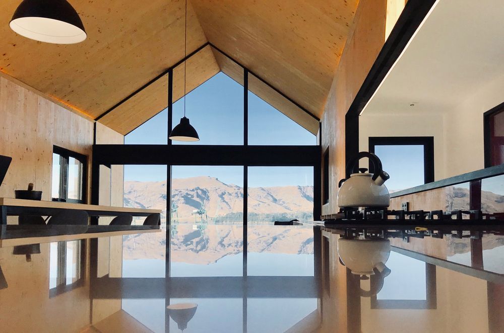Julie Villard of Bob Burnett Architecture's small 53m² Boat Shed home in Lyttleton has a 9 Homestar rating, and is constructed in CLT with steel portals, wood fibre insulation, rain water harvesting and energy consumption at 36.78 kWh/Y/m².