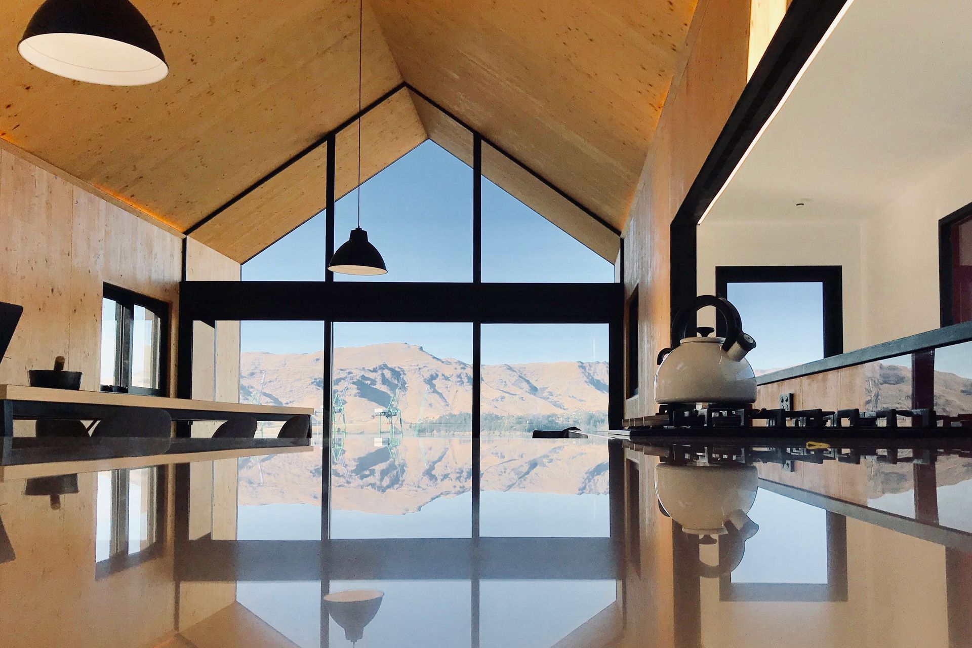 Julie Villard of Bob Burnett Architecture's small 53m² Boat Shed home in Lyttleton has a 9 Homestar rating, and is constructed in CLT with steel portals, wood fibre insulation, rain water harvesting and energy consumption at 36.78 kWh/Y/m².