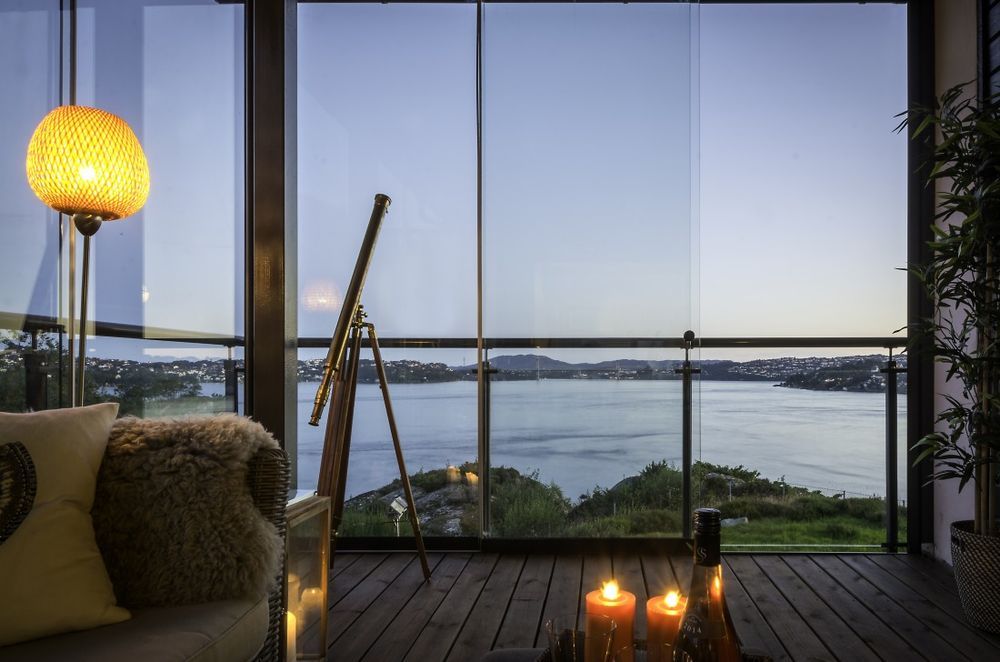 Sunflex sliding glass protecting a decking area