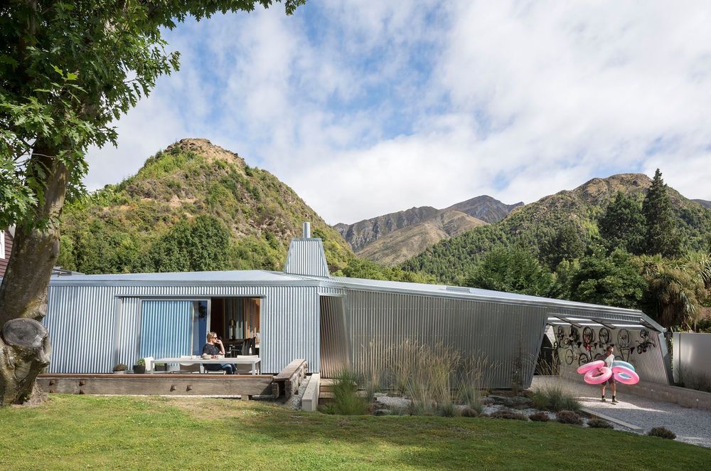 This distinctive corrugated iron-clad house in Arrowtown, central Otago, merges landscape and architecture. Its large, angled, sliding front door has been likened to a crevasse in the glaciers of the Southern Alps. 