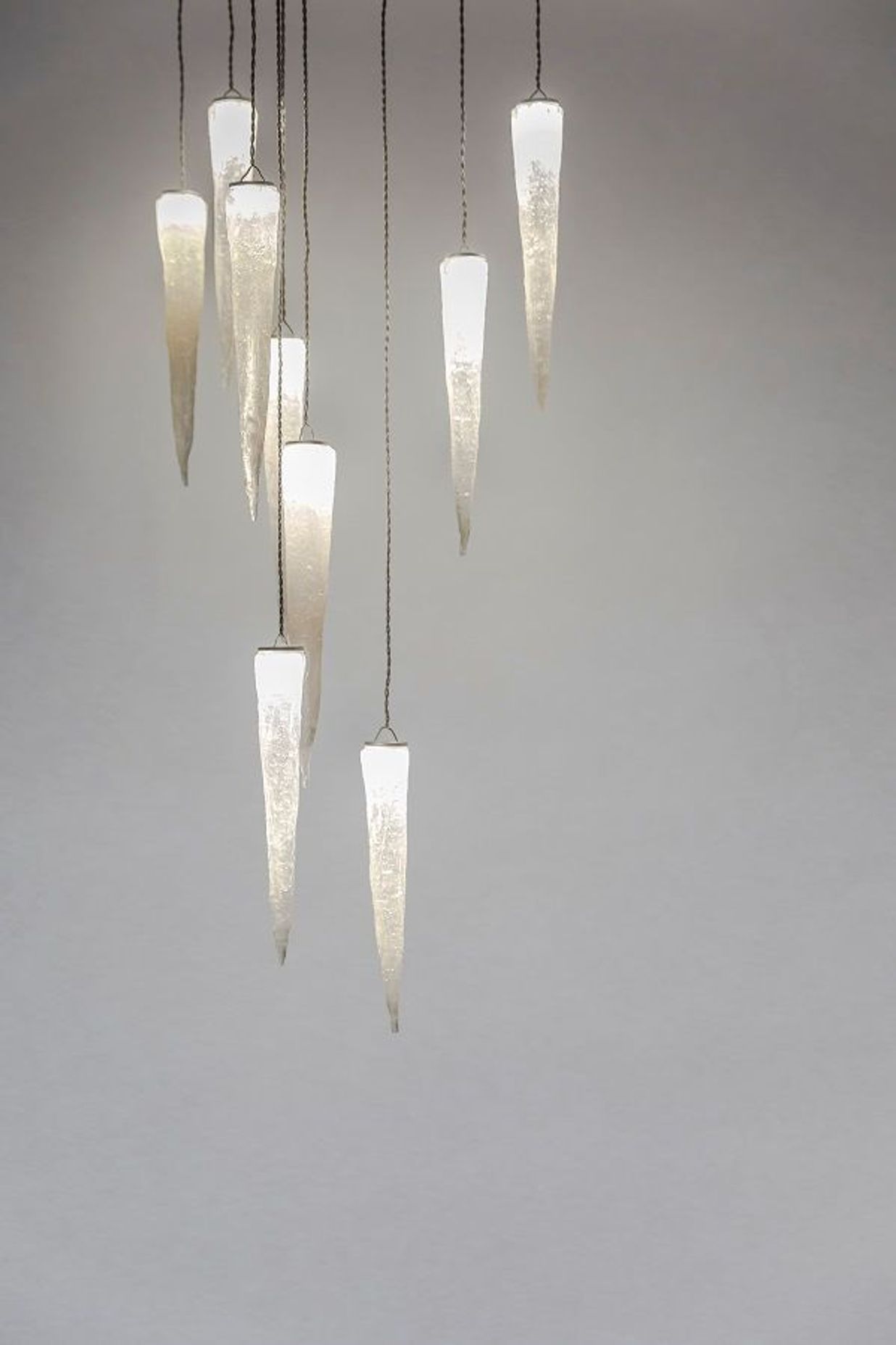 Stalactites: Inspired by a journey through a cave where calcite formations hang, each cast glass form is handcrafted.