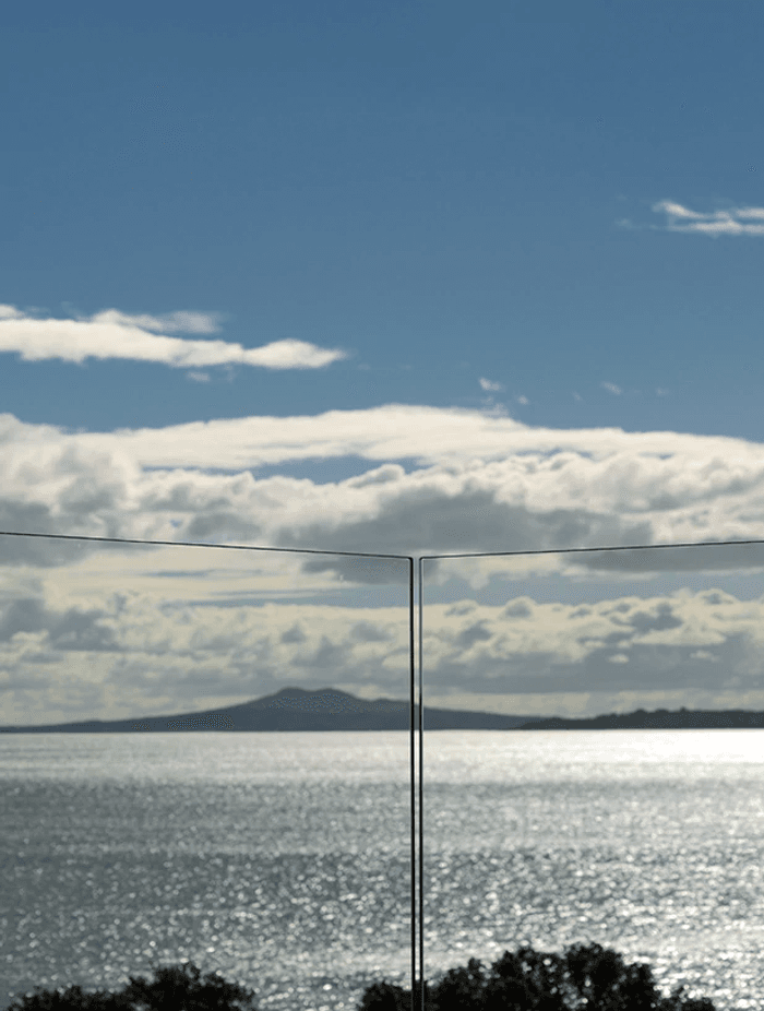 Let glass balustrades work their magic by keeping them free of anything that might obscure the view.