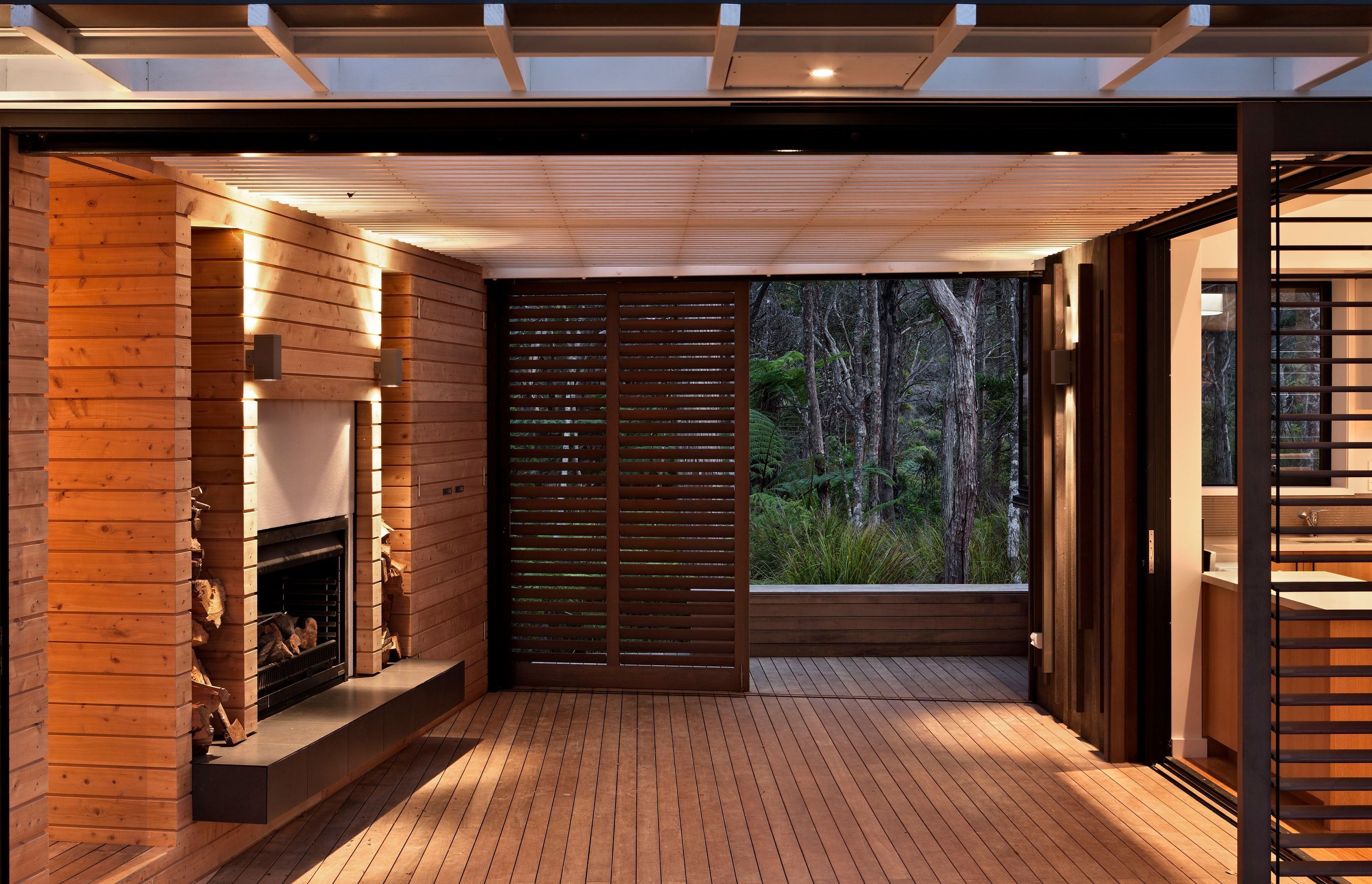 Pahi Bach by Scarlet Architects sits at one with its bush environment in the Kaipara Harbour.