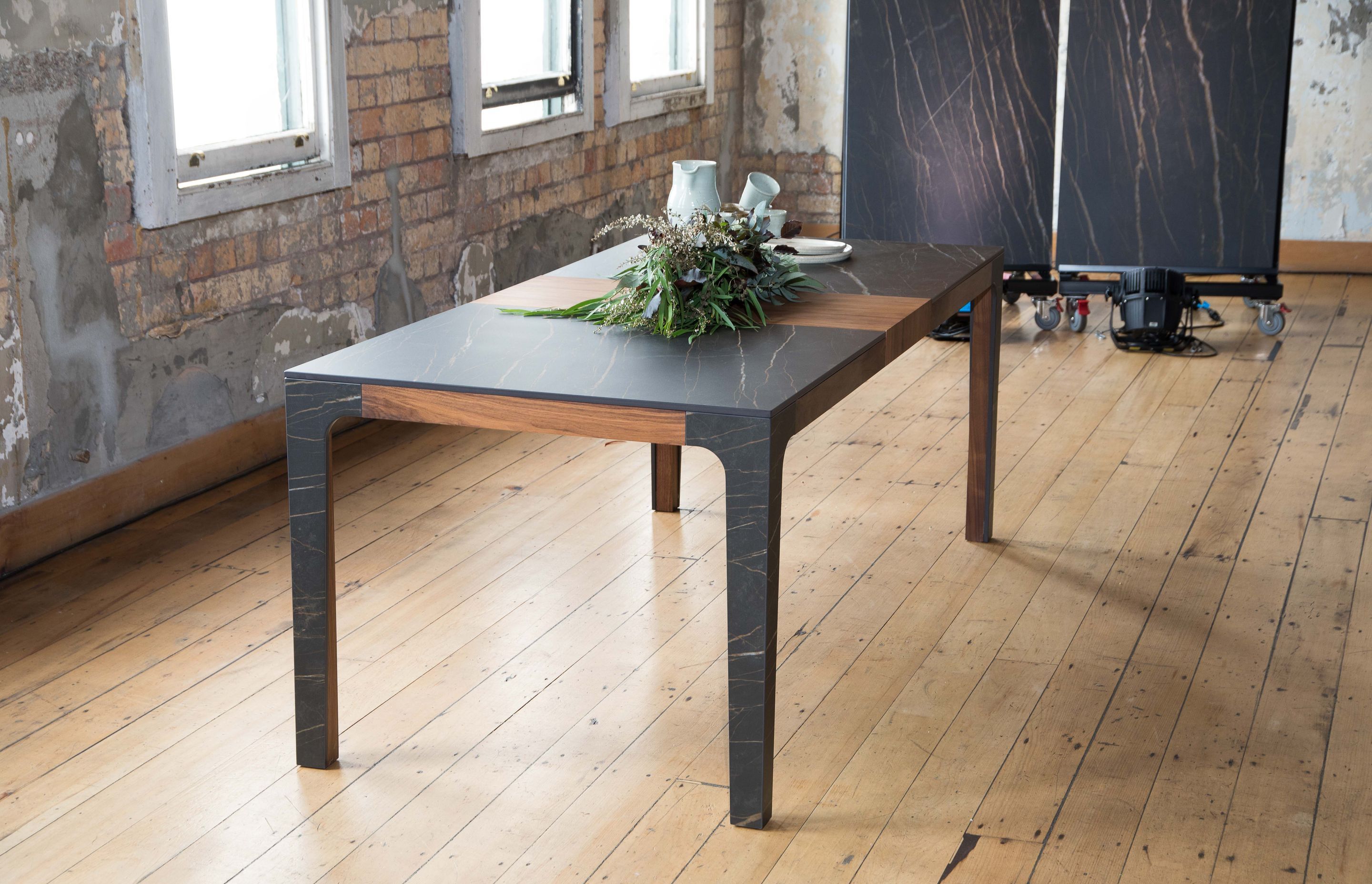 Interior designer Mal Corboy created this table with Laminam XL slabs and walnut timber.