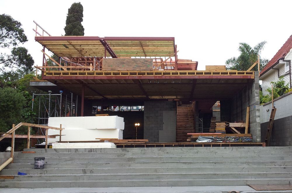 A view of the rear elevation shows the construction of the second-floor structure.