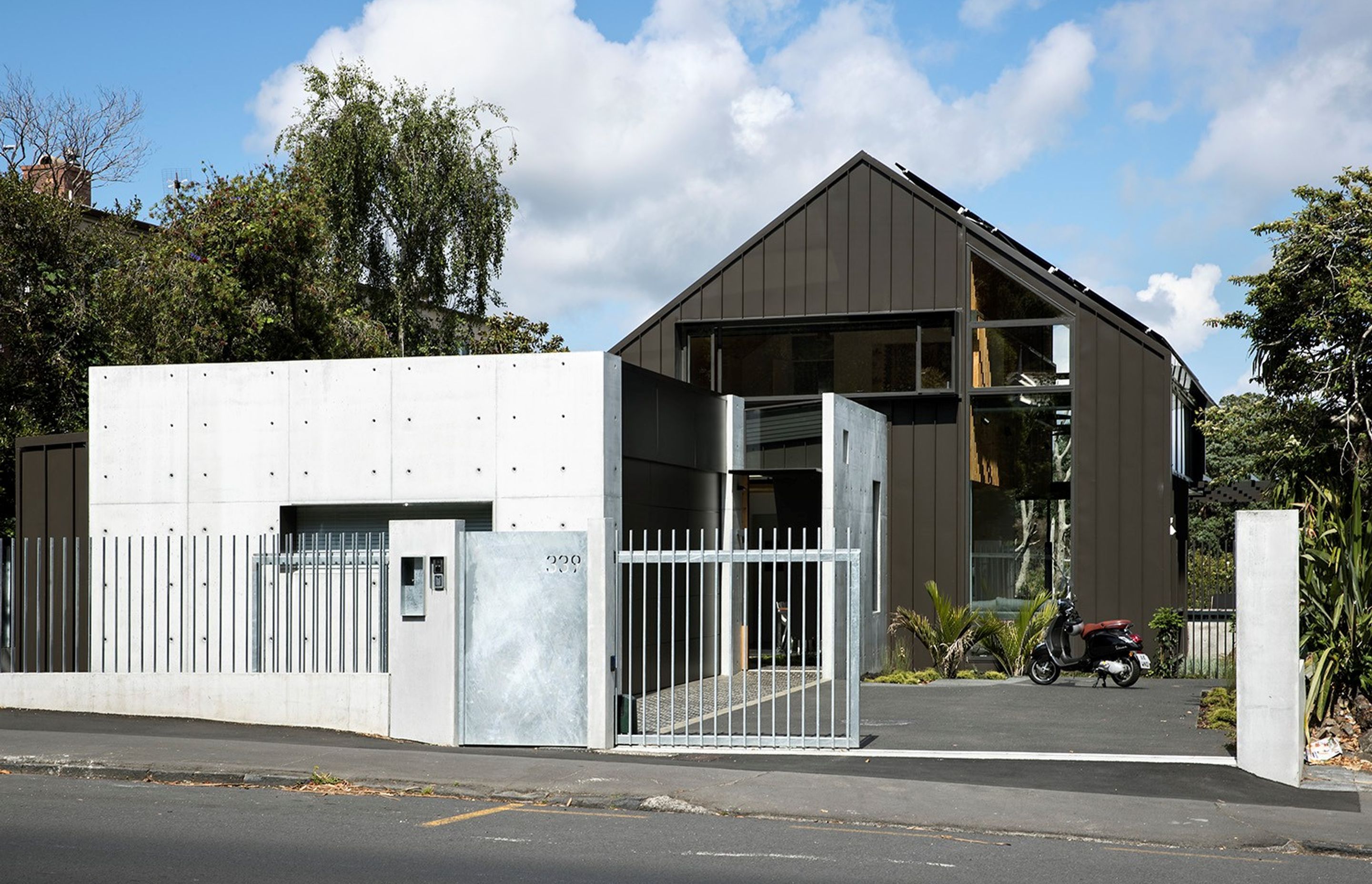 339 is situated on a busy road with constant diesel fumes, so utilises robust materials such as in-situ concrete, galvanised steel and easy wash-down Colorsteel cladding. By Strachan Group Architects. Photo by Simon Devitt.