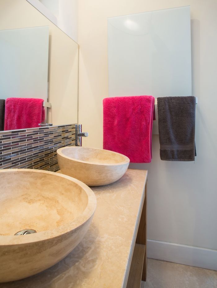 Infrared mirror heater panels keep bathroom walls and fittings warm, dry and free of mould.
