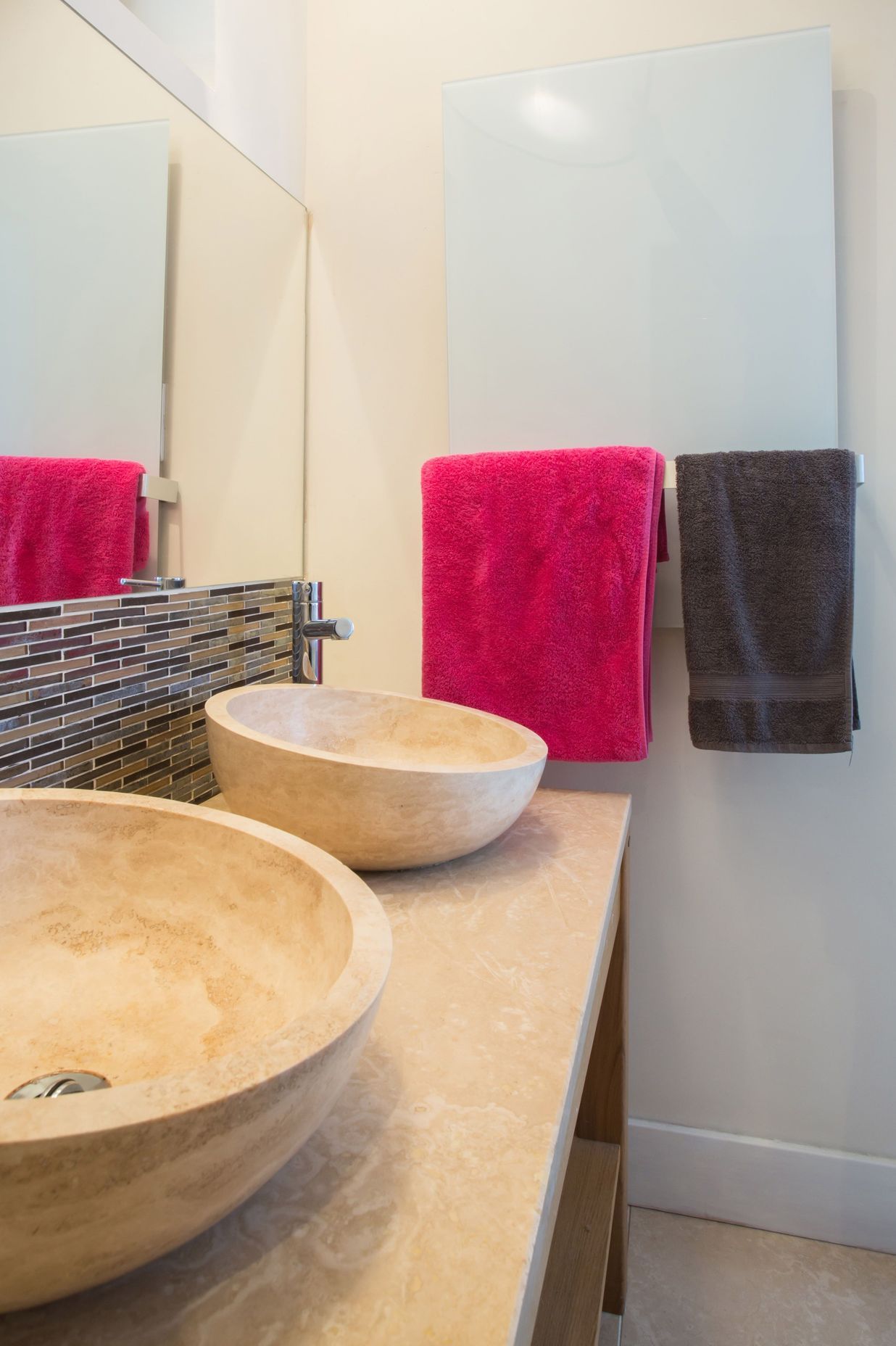 Infrared mirror heater panels keep bathroom walls and fittings warm, dry and free of mould.
