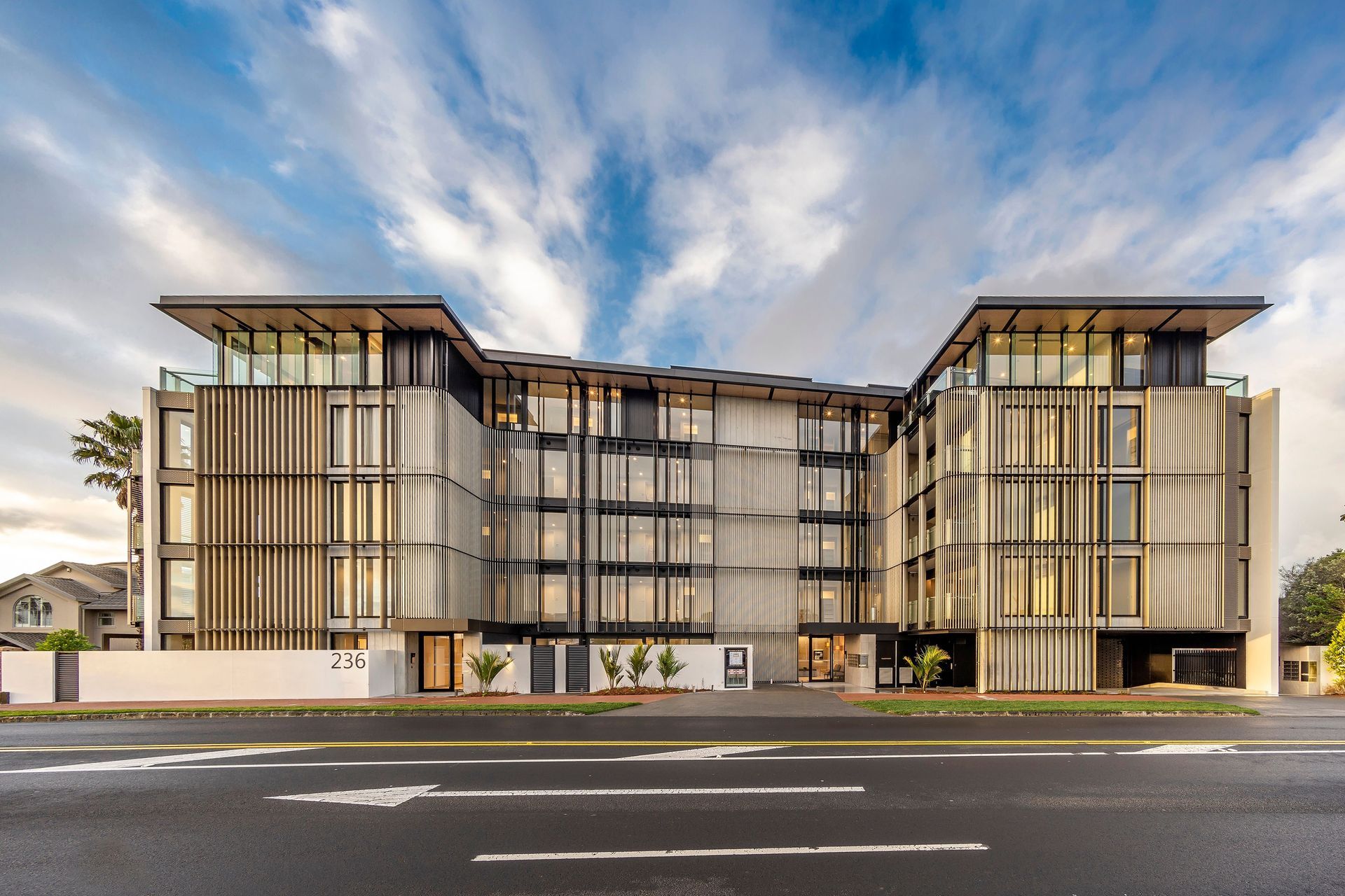 The apartment complex comprises 33 apartments across five storeys in the main building, and a further 10 apartments in two separate two-storey buildings to the north of the site. 
