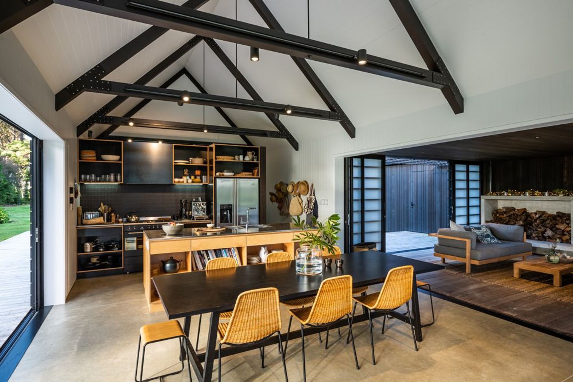 The eastern cabin houses the living/dining/kitchen areas along with the main bedroom, while the western cabin contains the guest bedroom and bunk room.