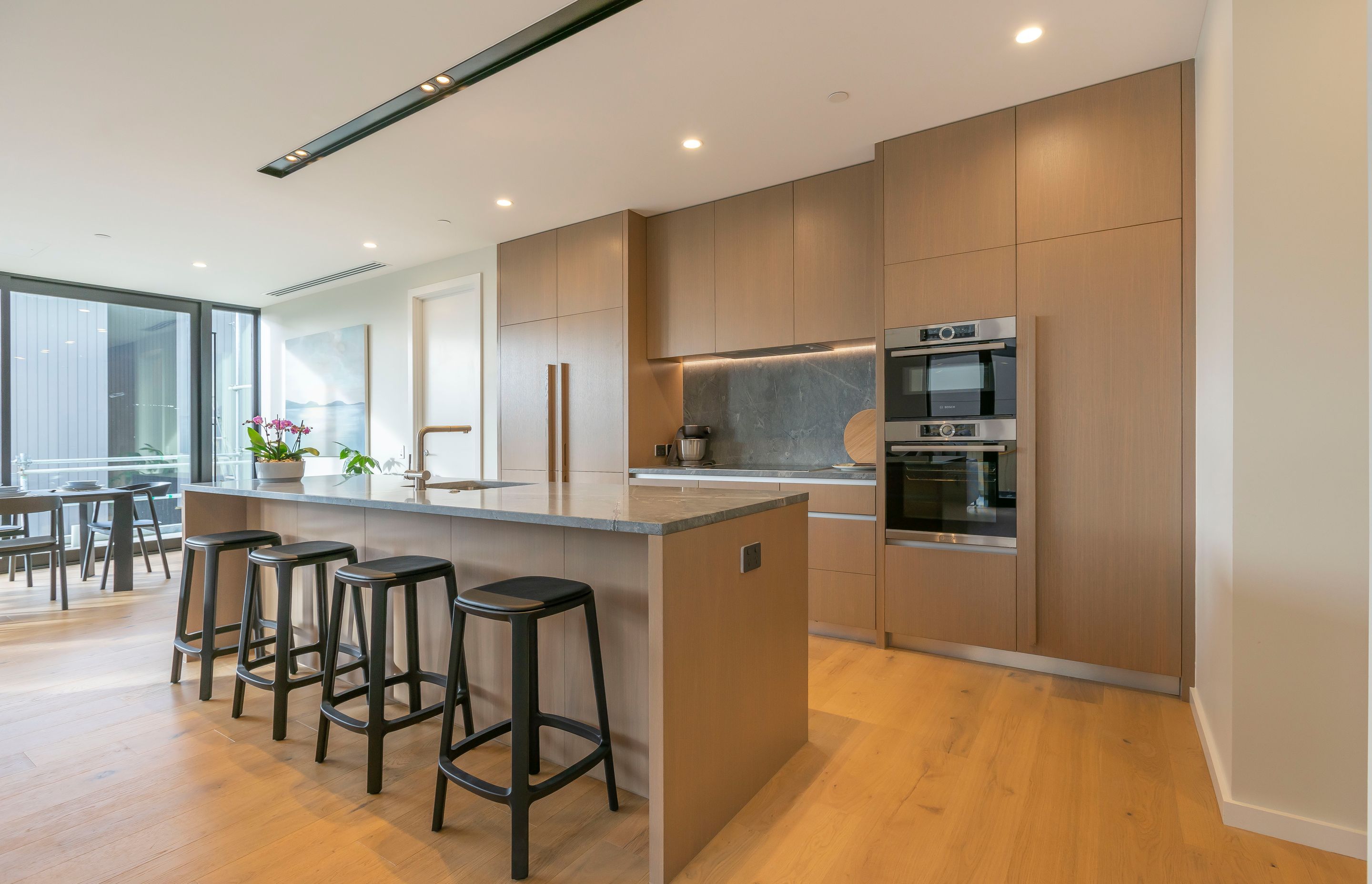 The interior material palette of the apartments is driven by a connection to the idea of Mission Bay and Kohimarama being beachside communities. All kitchen cabinetry featured by Sharp and Page.
