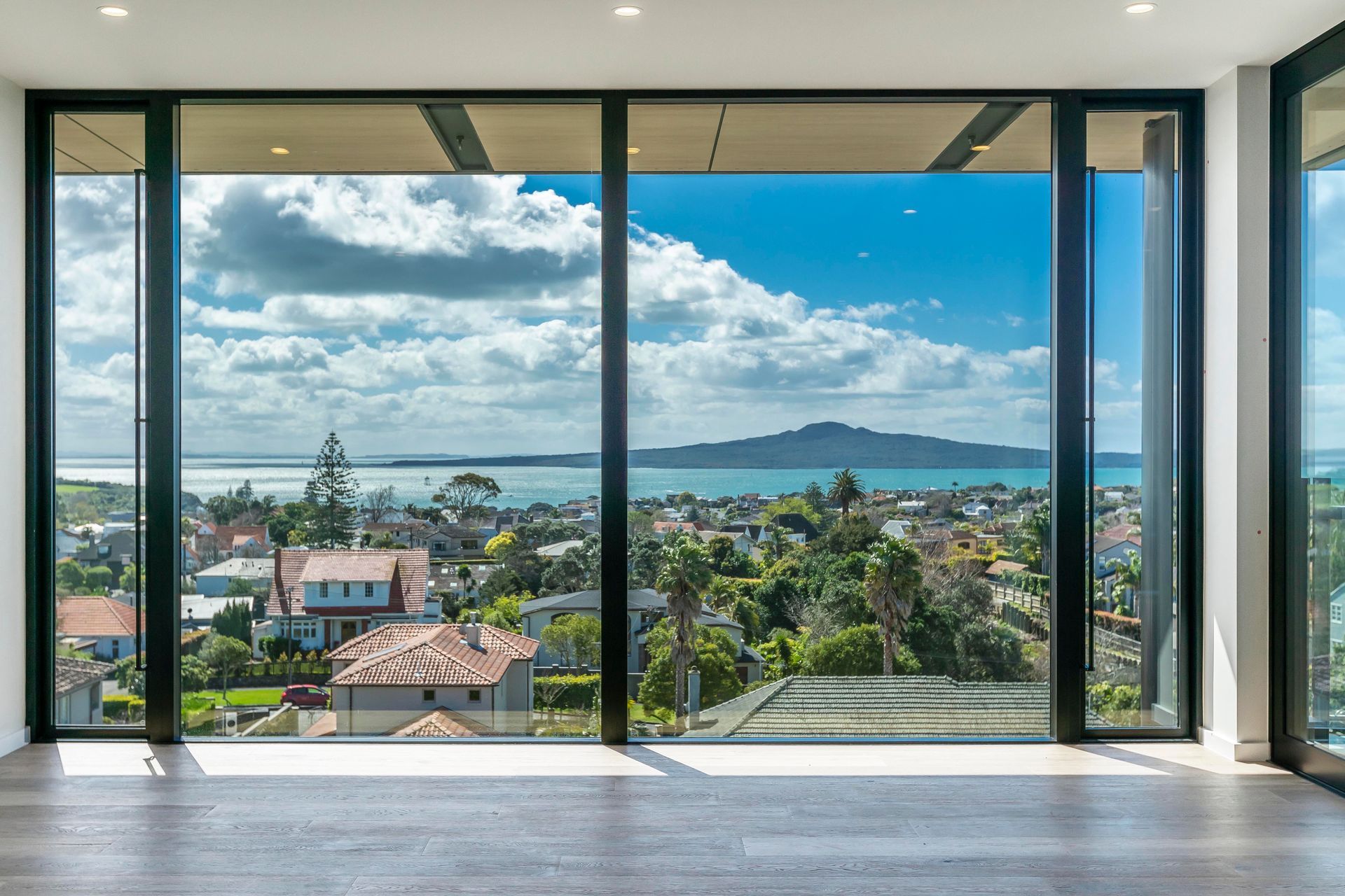 Due to its location on a ridgeline, and scale in comparison to the surrounding built environment, the views across to Rangitoto were a drawcard and resulted in the use of a facade glazed with high performance glass.