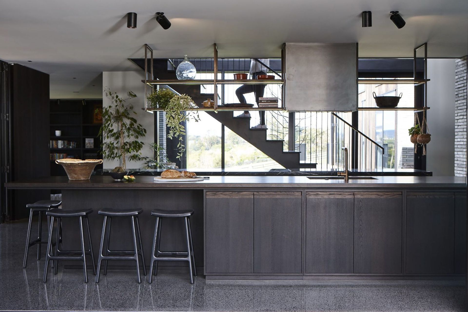 Two five-metre benchtops make up the kitchen, conceived as two elemental forms; one in marble the other in timber.