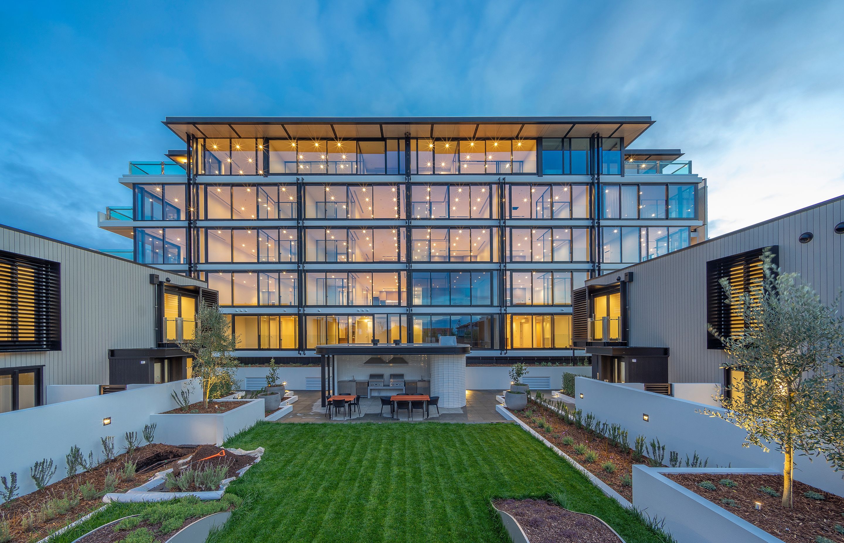 The northern facade is entirely glazed to maximise the experience of the northern sun and views, while the lower two buildings offer a different facade entirely, clad in vertical shiplap cedar.