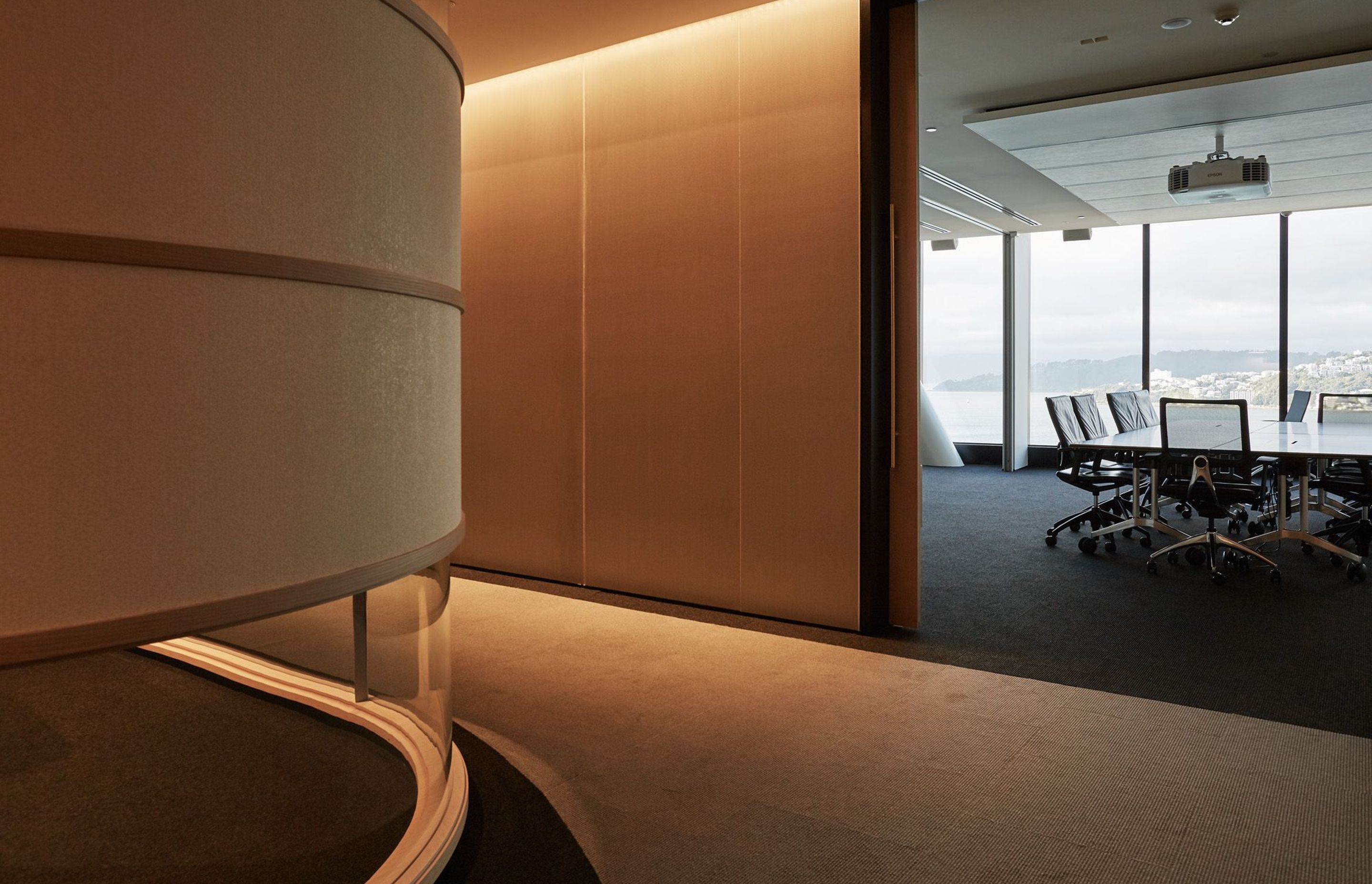 Large meeting rooms run around the edges of the building with views of Wellington Harbour and the neighbouring cityscape.