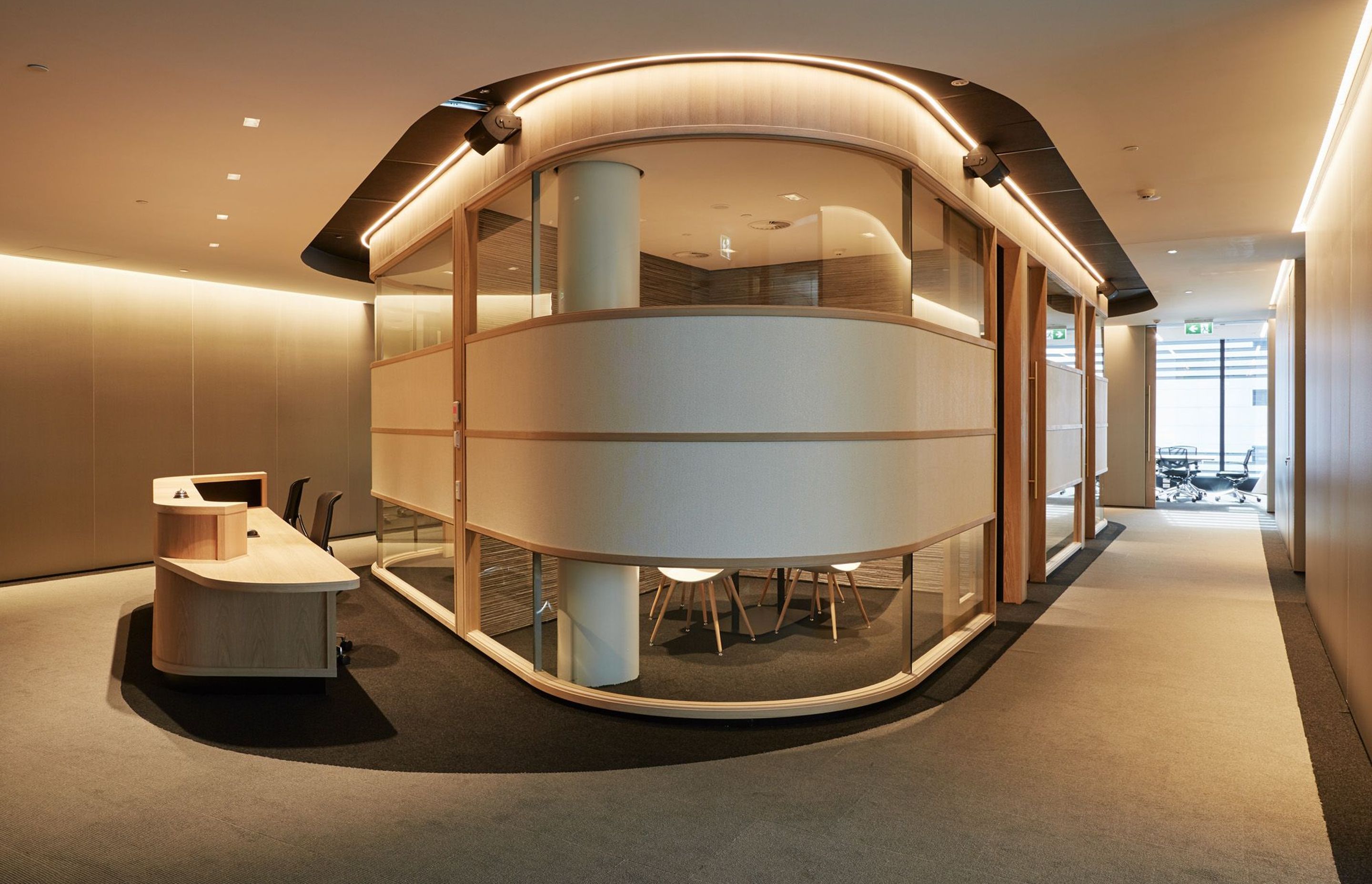 Deloitte's reception area on the 12th floor features a curvaceous internal pod that wraps around small meetings rooms,