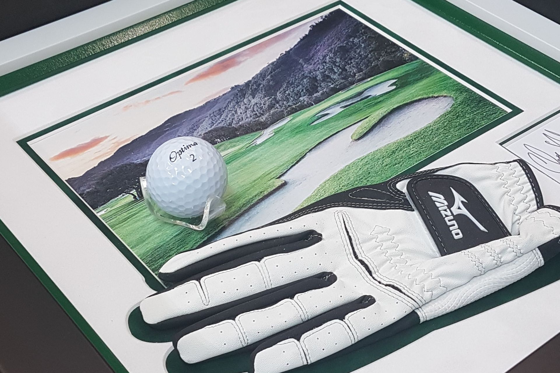 Augusta with golf ball and glove