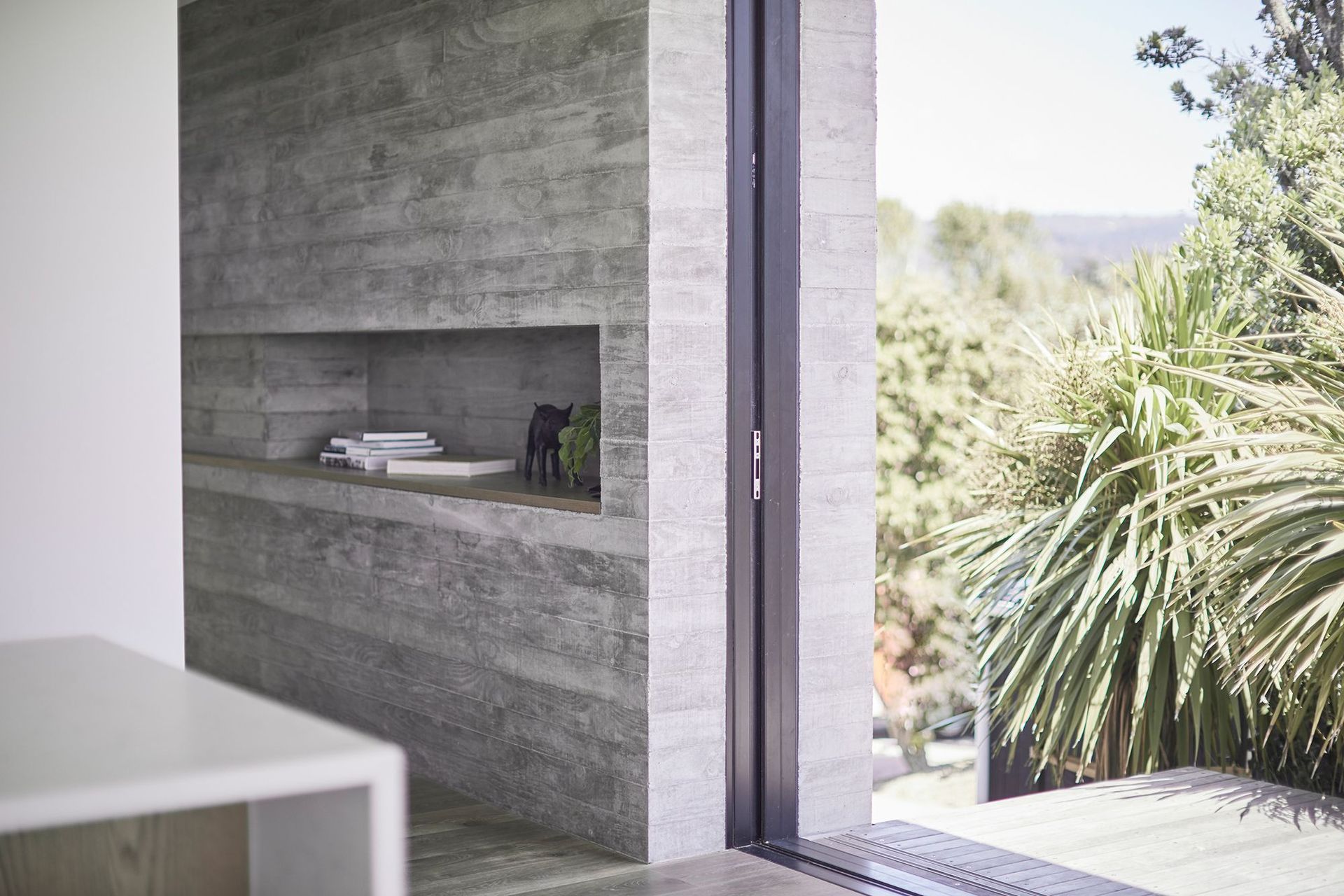 The first of the three interior in situ concrete features is on the western elevation and doubles as both a structural wall and a method of completely concealing three doors and two screens when opened.