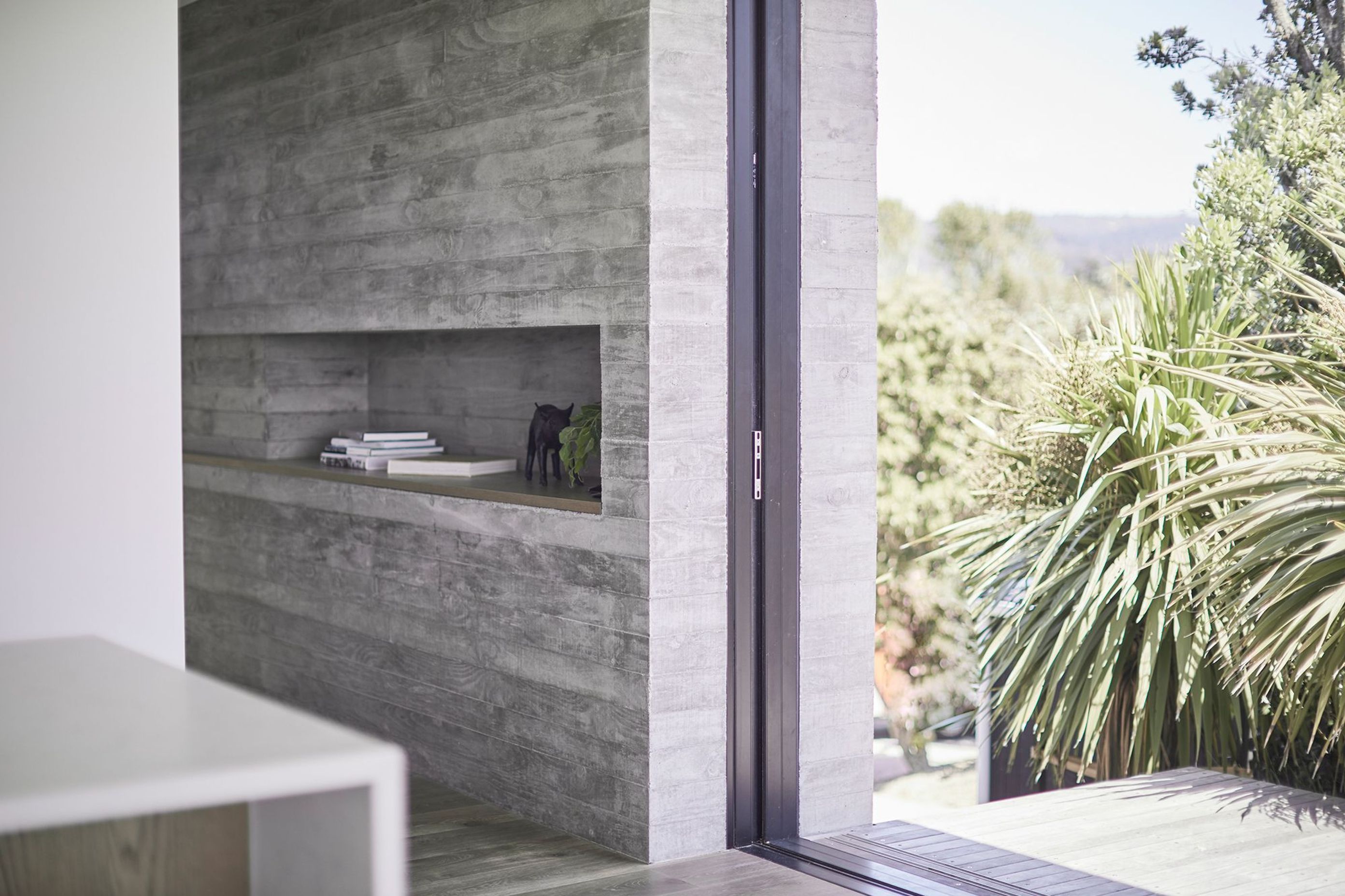 The first of the three interior in situ concrete features is on the western elevation and doubles as both a structural wall and a method of completely concealing three doors and two screens when opened.