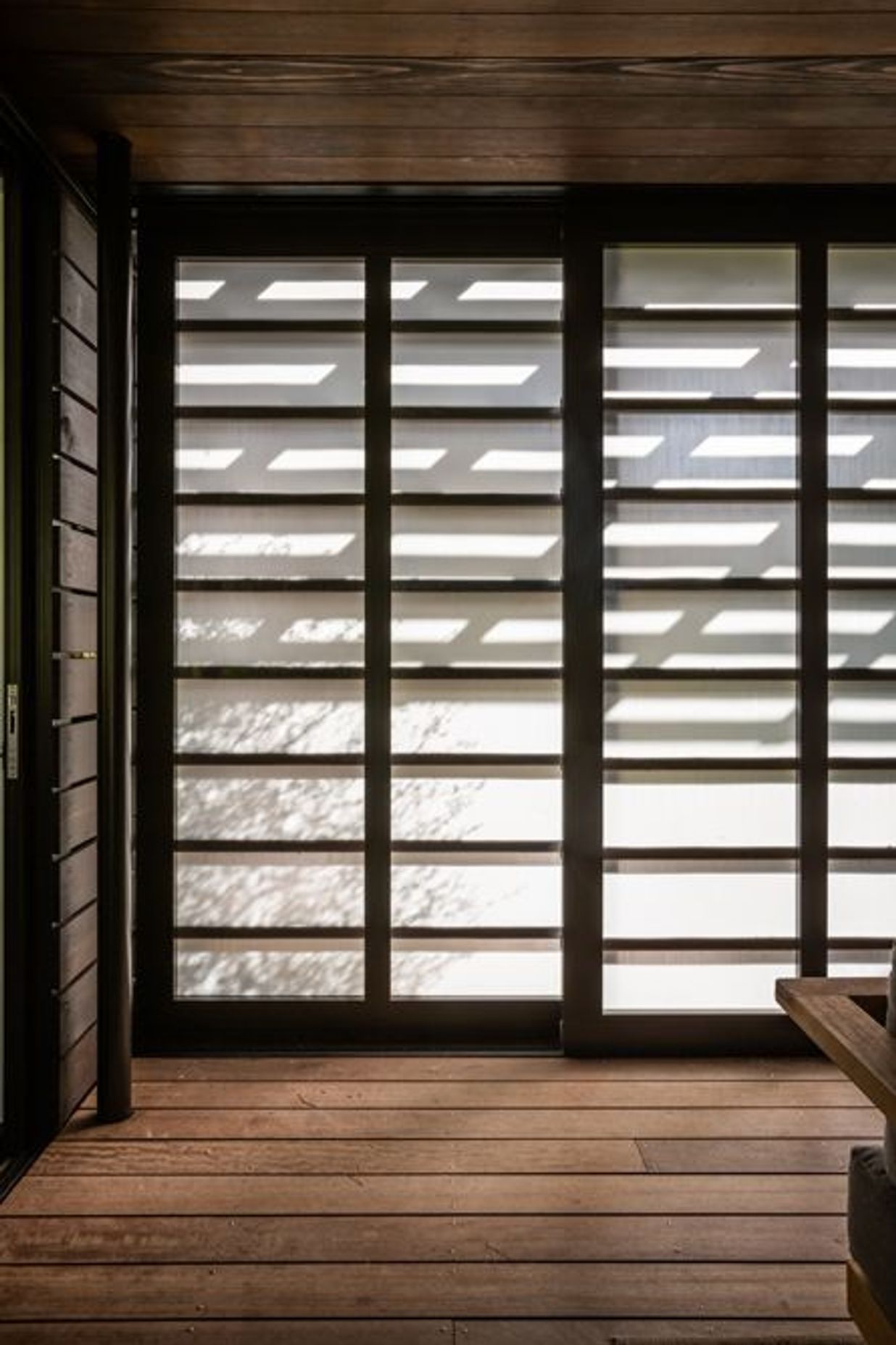 Light and shadow dance across the shoji screens.