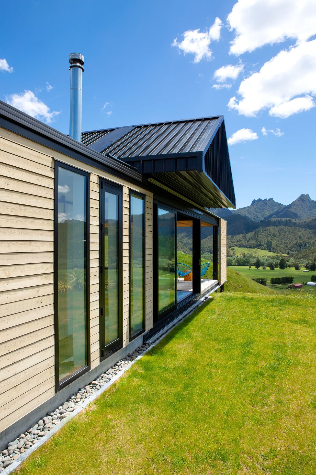 Taking cues from the rural vernacular of farm buildings, in both structure and materiality, the house is simple and uncomplicated, designed to sit lightly on the land.