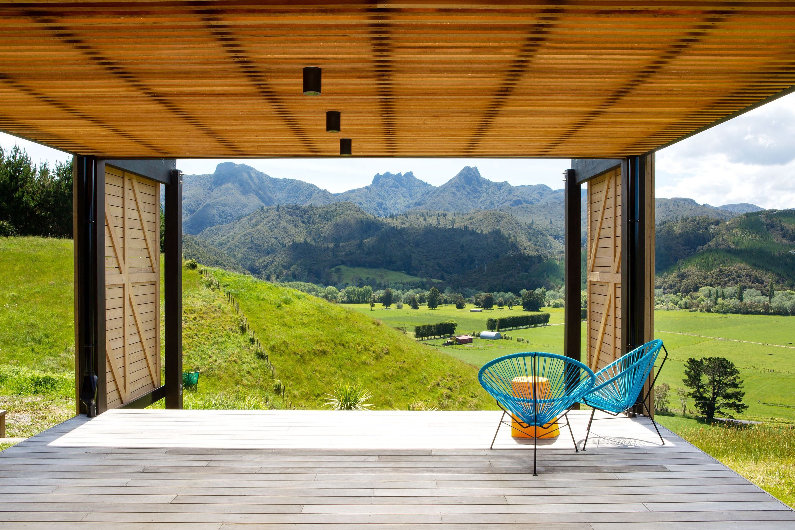 Looking out to The Pinnacles, this covered deck is one of two outdoor living options offering close connection to the land and views. 