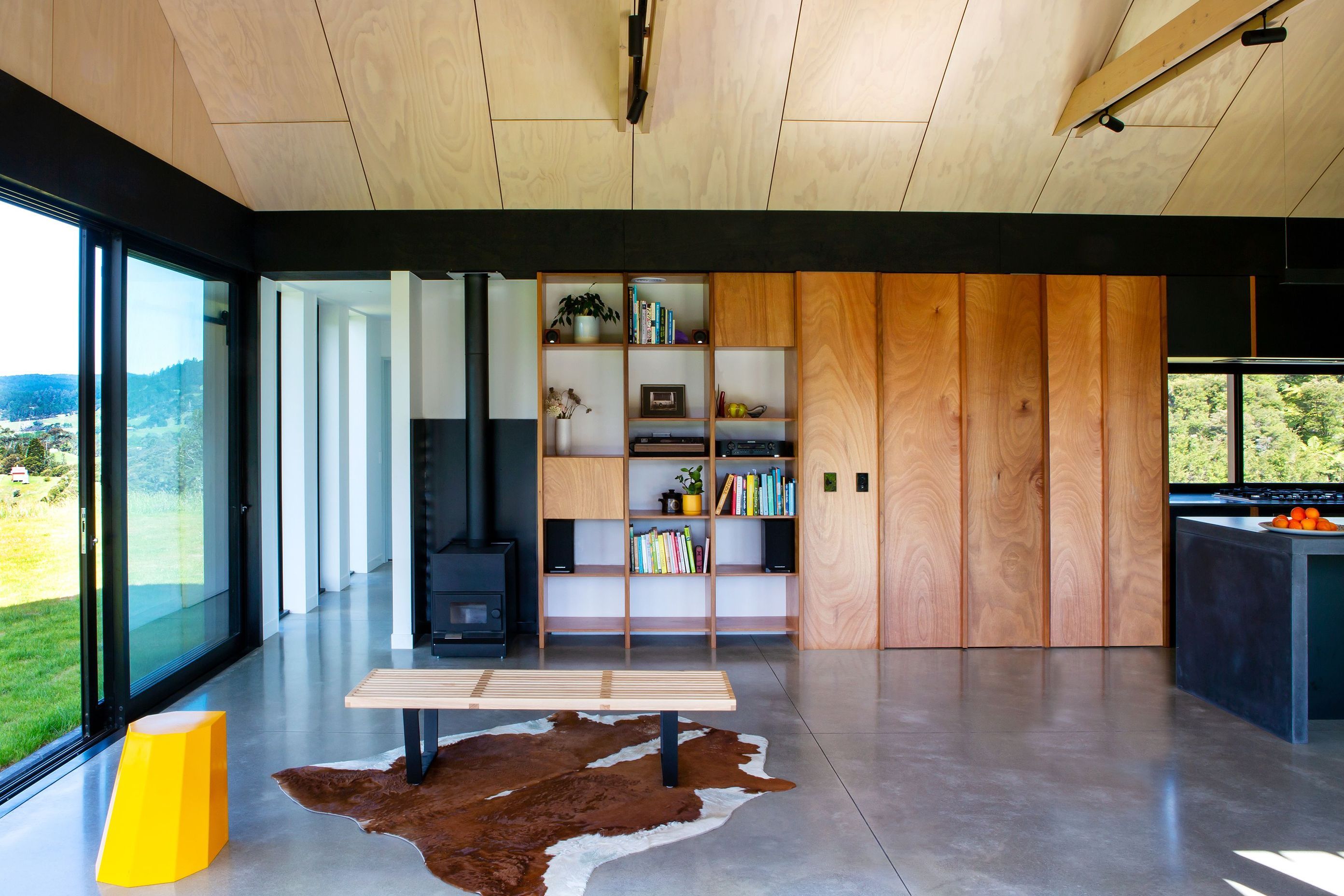 An exposed concrete slab is combined with simple materials dominated by timber with a whitewashed ply ceiling.