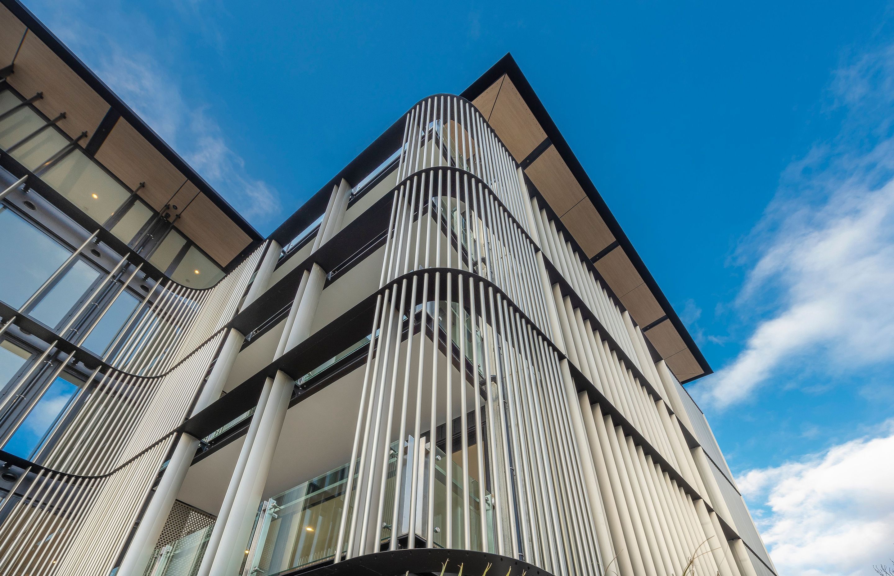By incorporating the screens, the southern facade could retain a primarily glazed exterior.