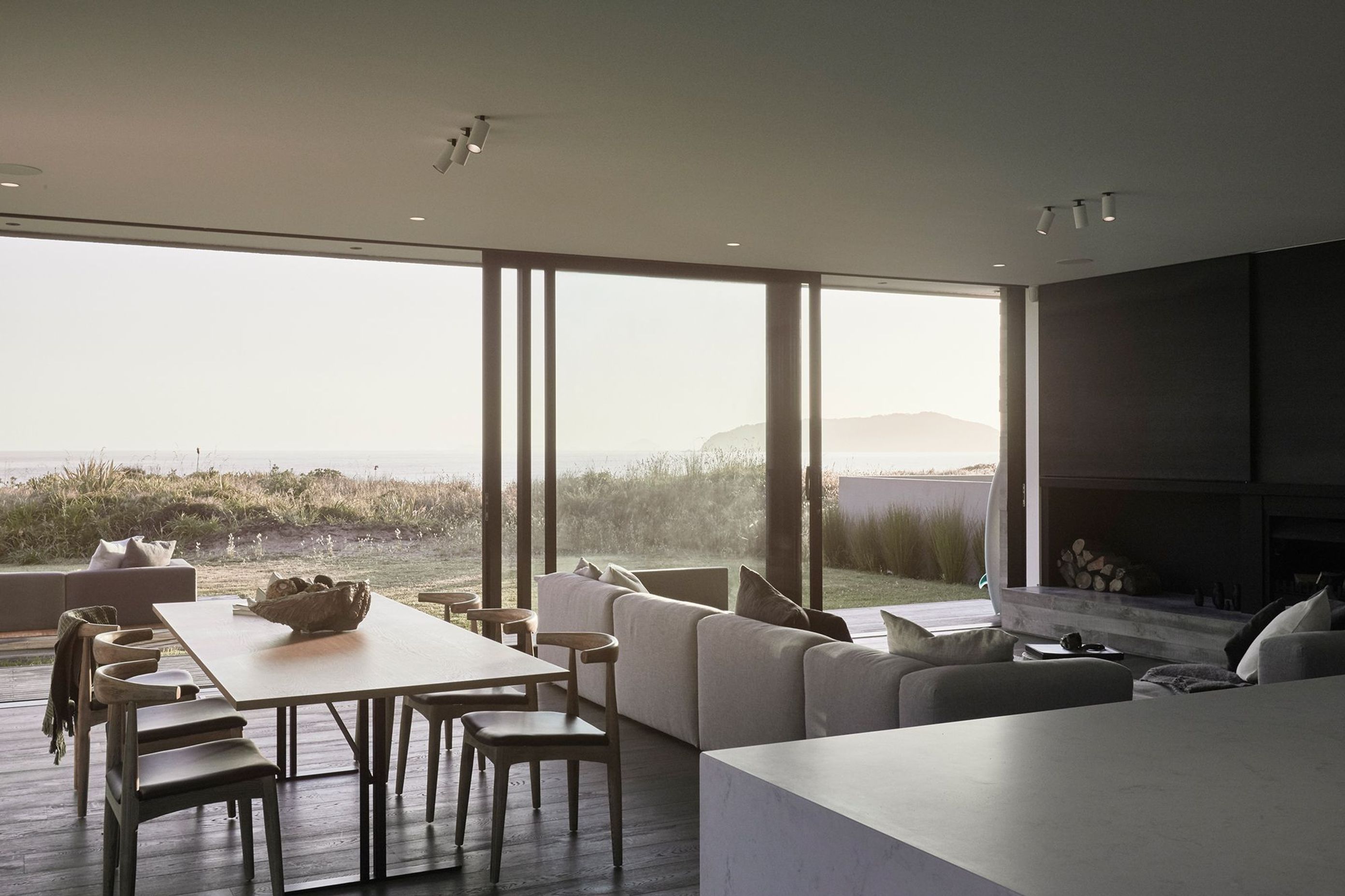 Here, the muted palette of the interiors blur seamlessly into the sun drenched coastal beige beyond.