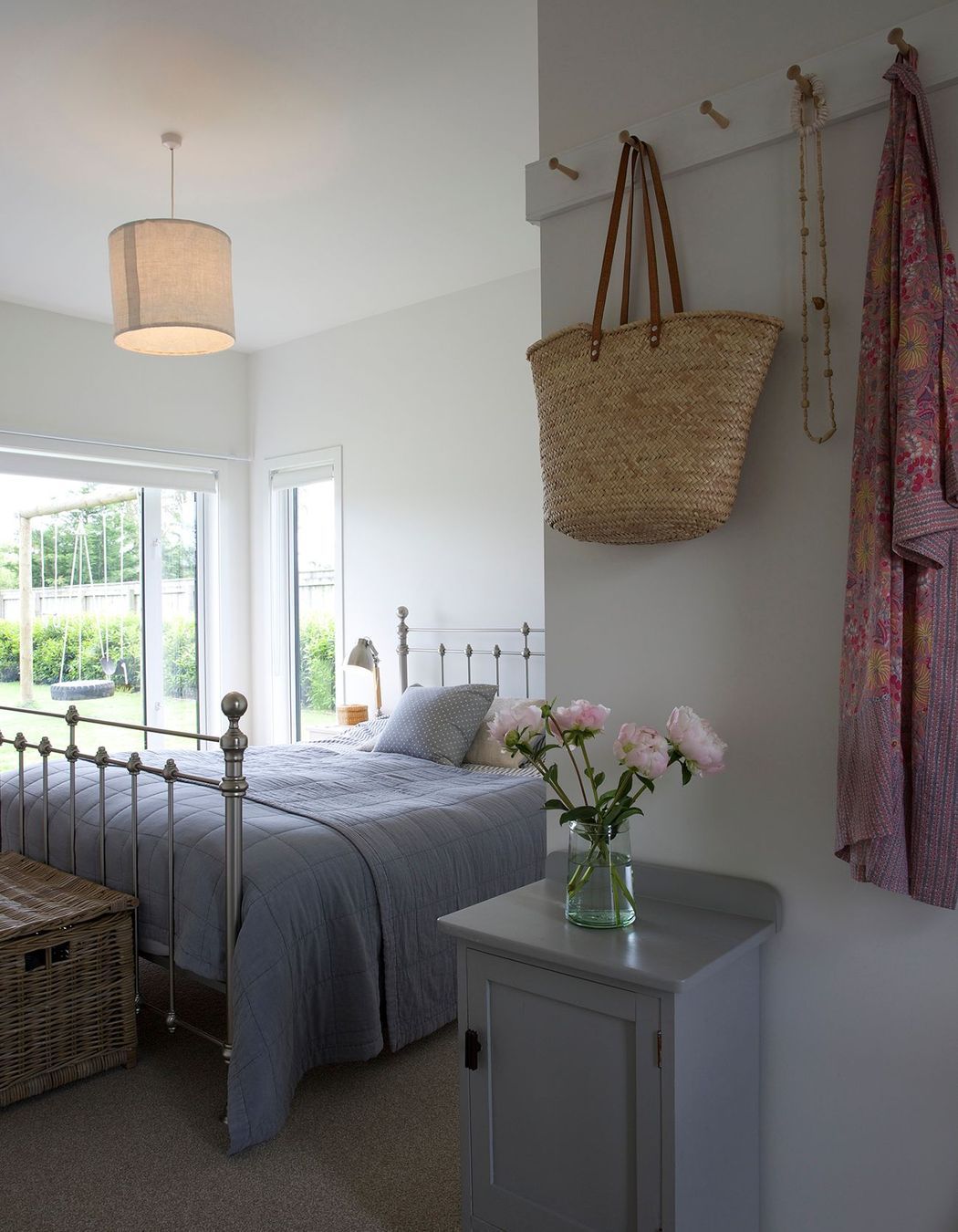 The master bedroom continues the natural palette of colours and materials.