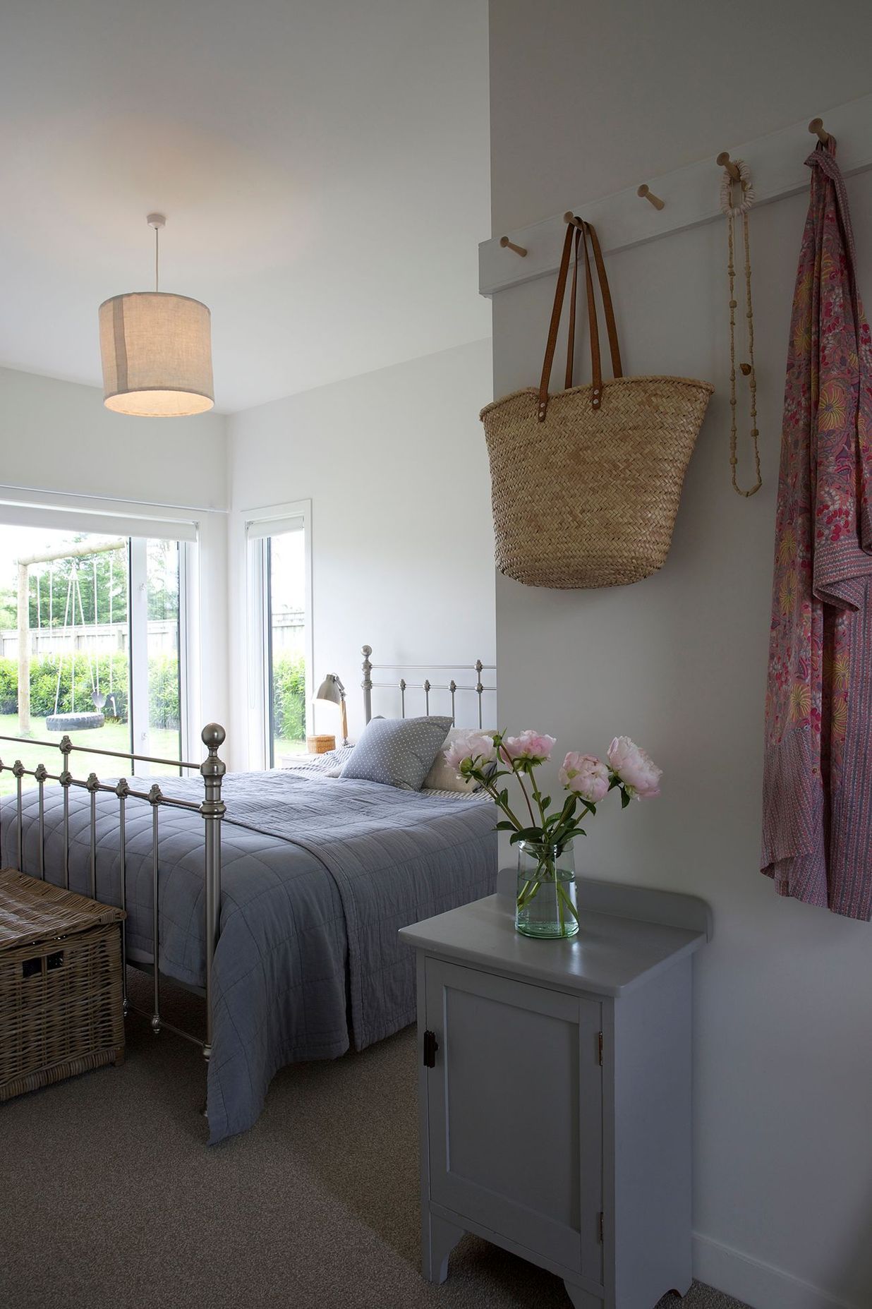 The master bedroom continues the natural palette of colours and materials.