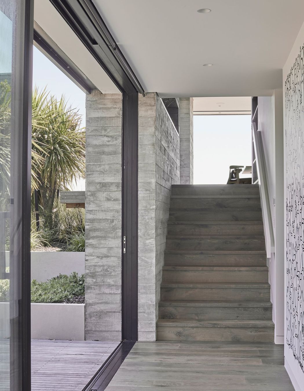 The second of the three internal in situ concrete features runs along the stairwell incorporating a striking recessed shelf.