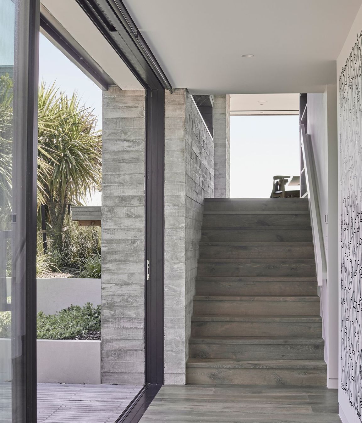 The second of the three internal in situ concrete features runs along the stairwell incorporating a striking recessed shelf.