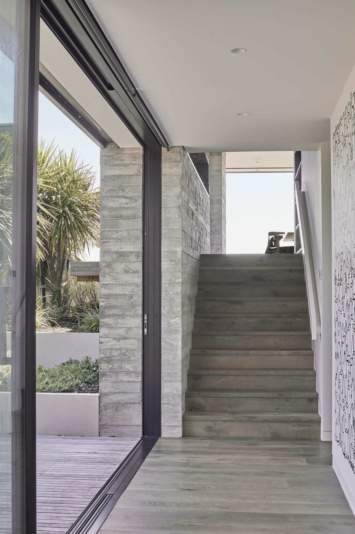 The second of the three internal in situ concrete features runs along the stairwell incorporating a striking recessed shelf.