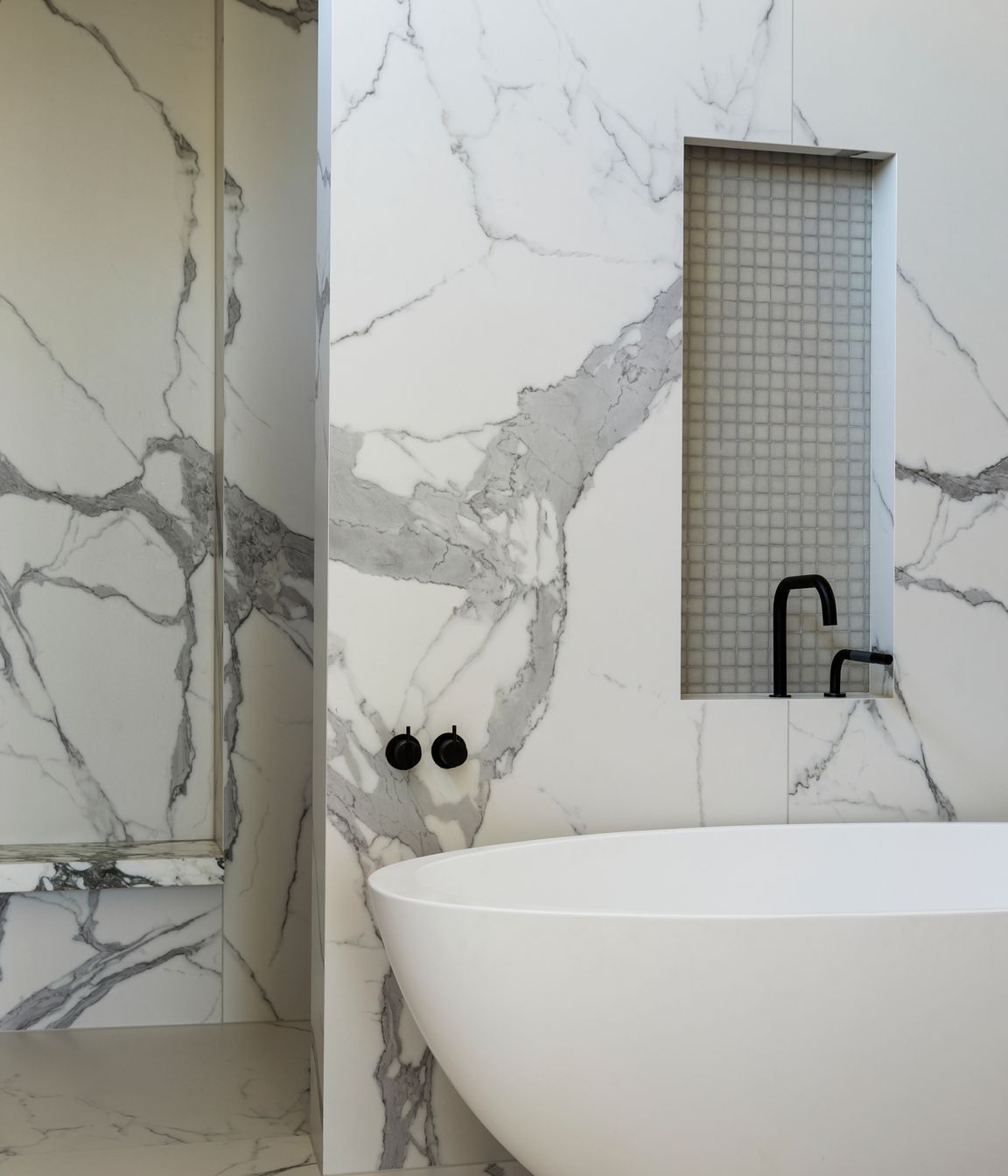 A curvaceous bath echoes the curved walls seen in some of the smaller rooms.