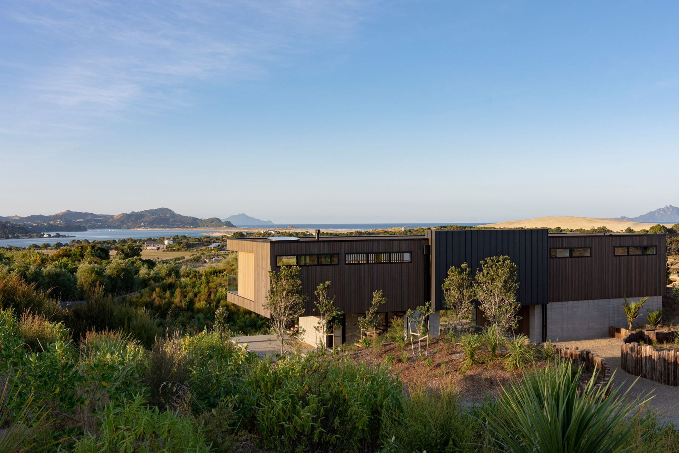 The single-level holiday house is designed to capture the views out across the estuary and over to the Hen and Chicken Islands.