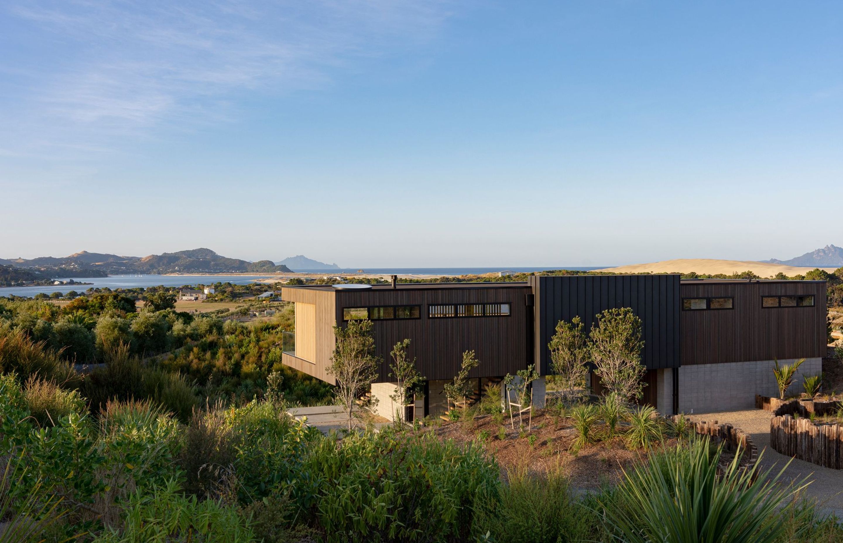 The single-level holiday house is designed to capture the views out across the estuary and over to the Hen and Chicken Islands.