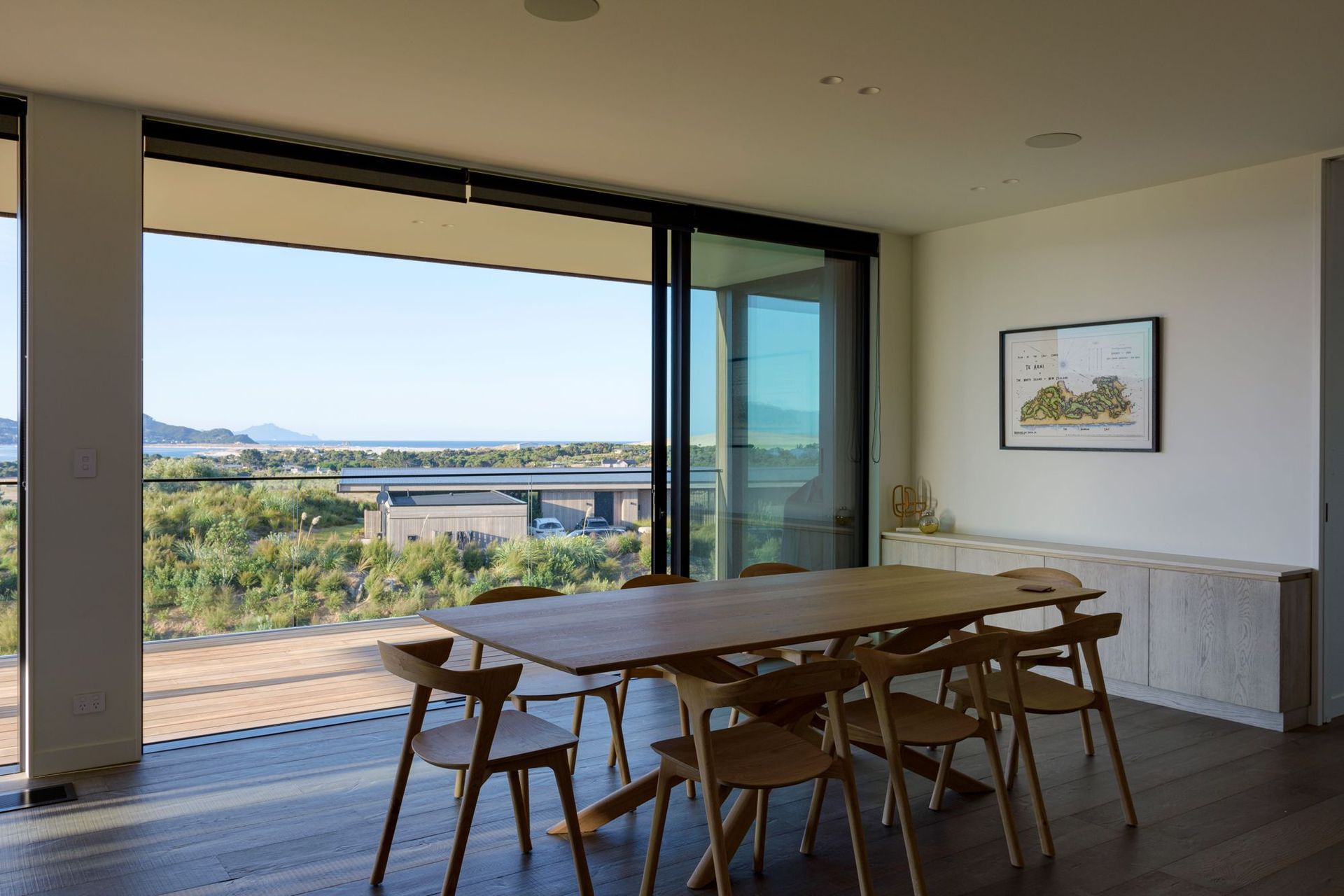 Extensive decking accessed by sliding doors allows the living and dining areas to open up to the outdoors. 