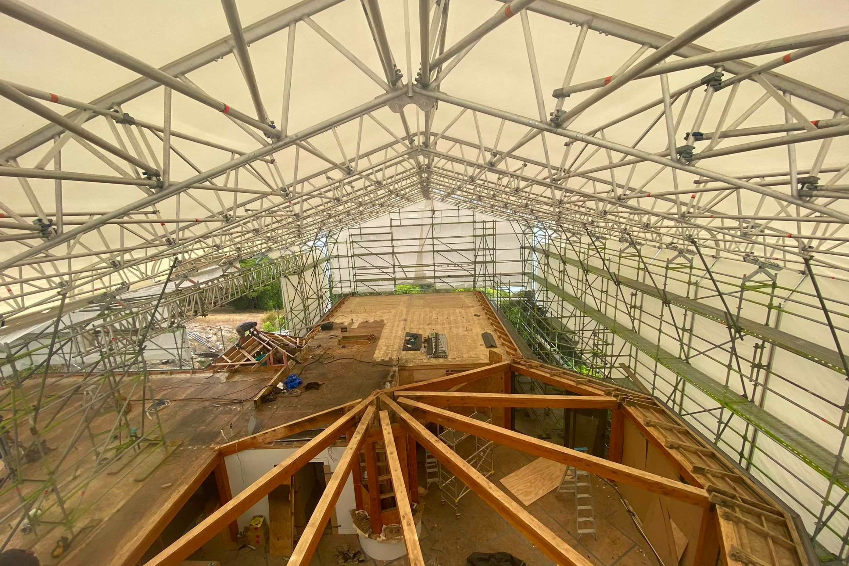 The same change of direction section of the roof stripped back.