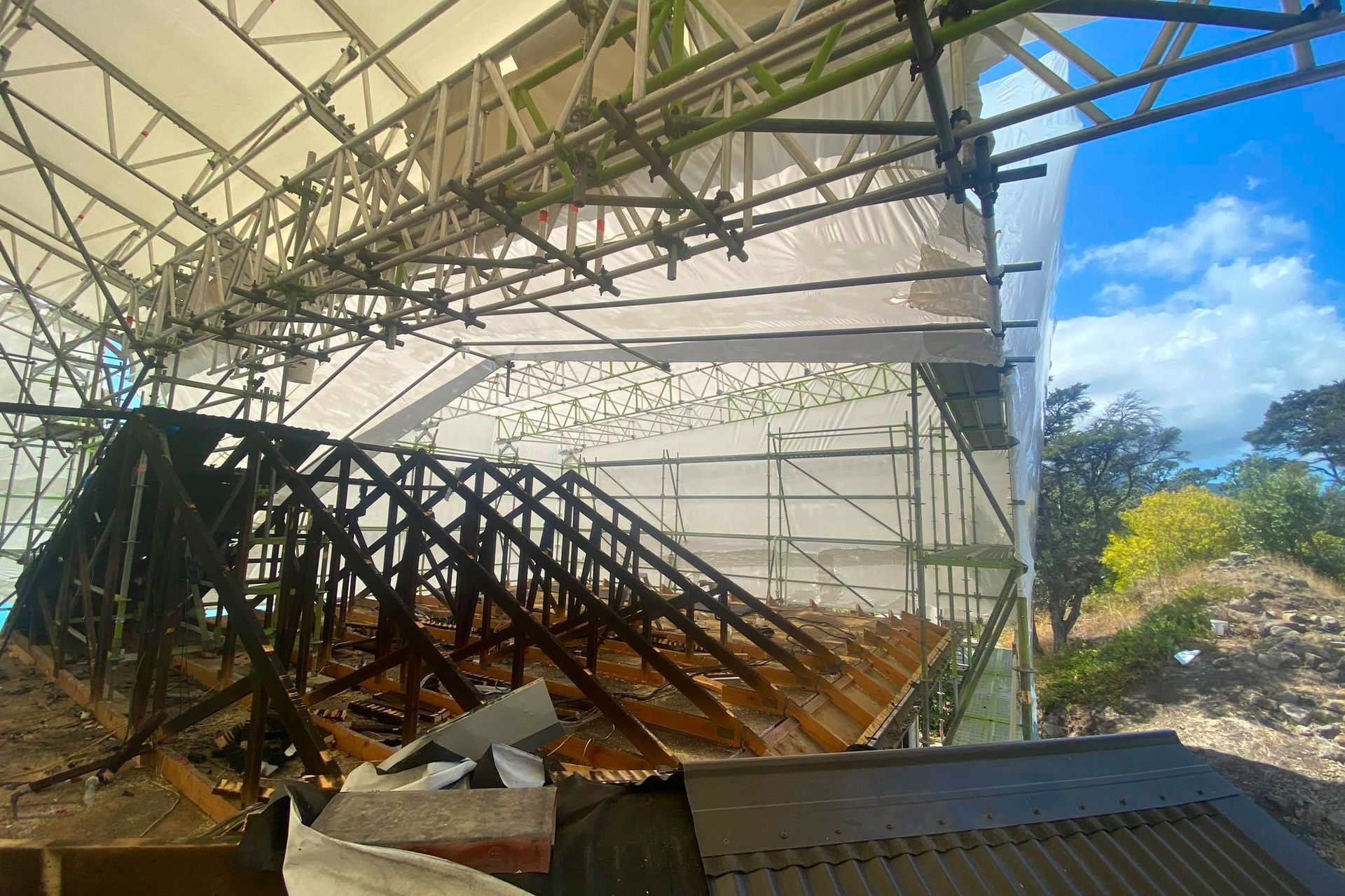 Area where the existing burnt materials had to be removed and new substrate prepared by Builder before re-roofing took place.