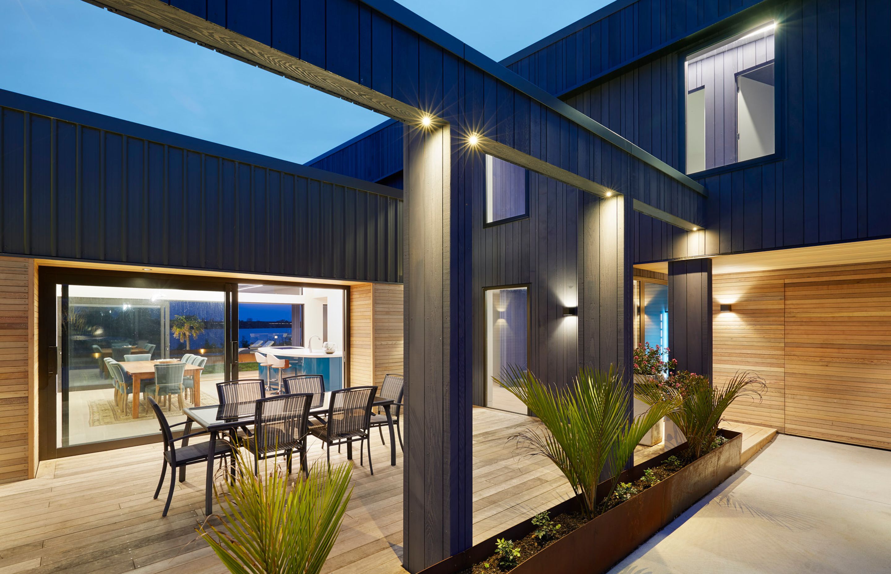 The three bedroom, two bathroom home is built for lifestyle and entertaining with open plan kitchen, living and dining opening out onto three covered outdoor areas and a stunning pool with surrounding deck built into the landscape and surrounded by Corten