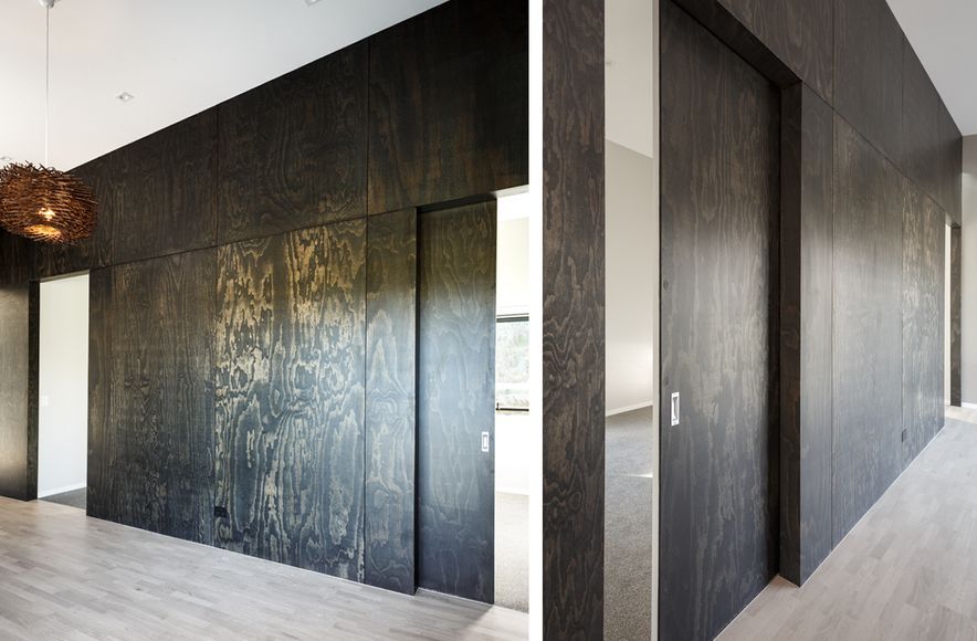 A striking feature wall in black satin plywood